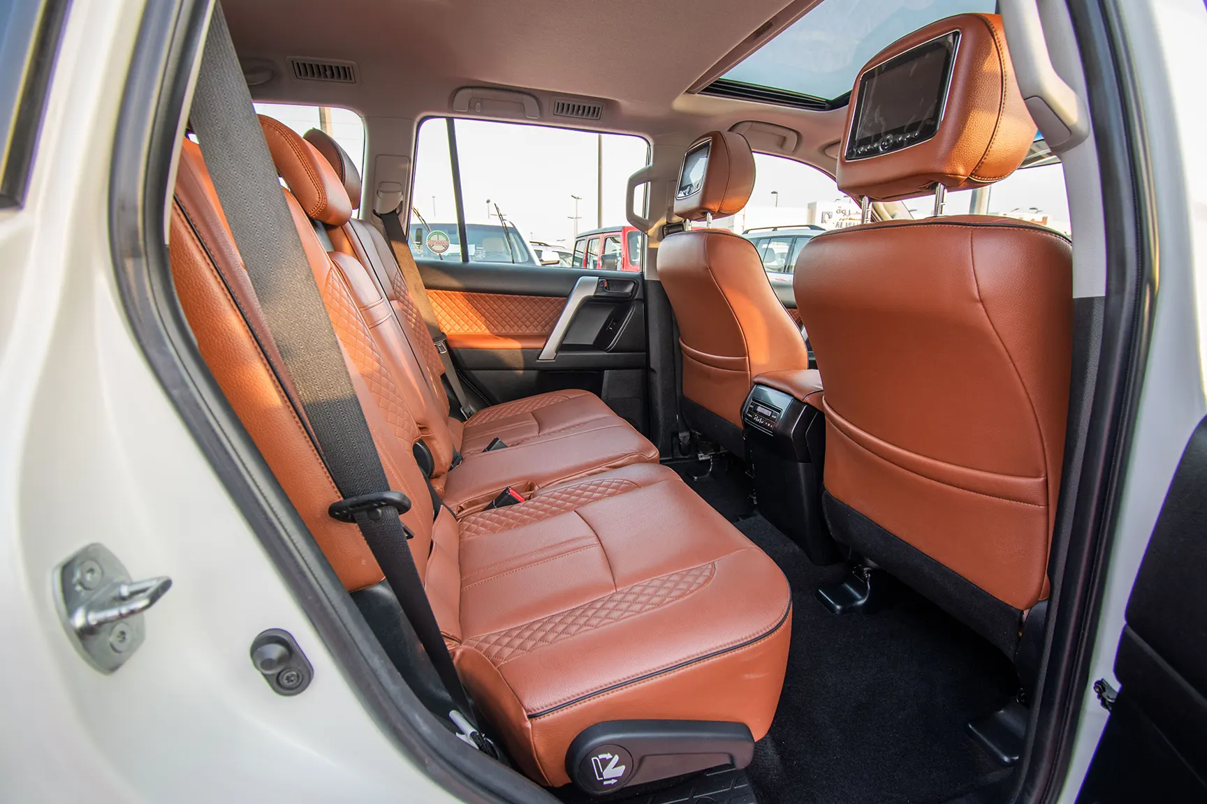 Used 2017 Toyota Prado VXR White – Rear Passenger Side Cabin View at First Choice Cars Sharjah