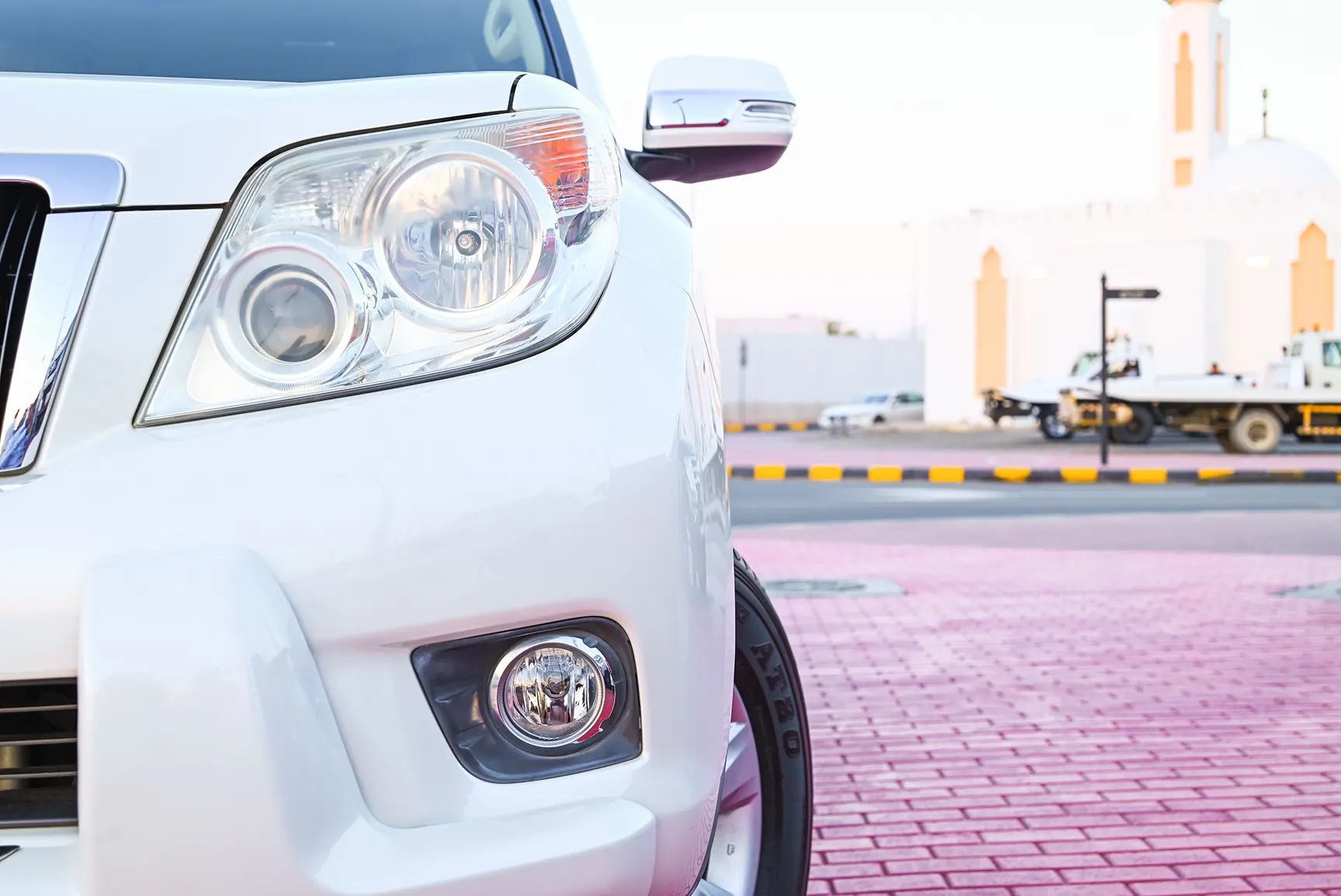 Used 2013 Toyota Prado Txl White – Headlight Close-up at First Choice Cars Sharjah