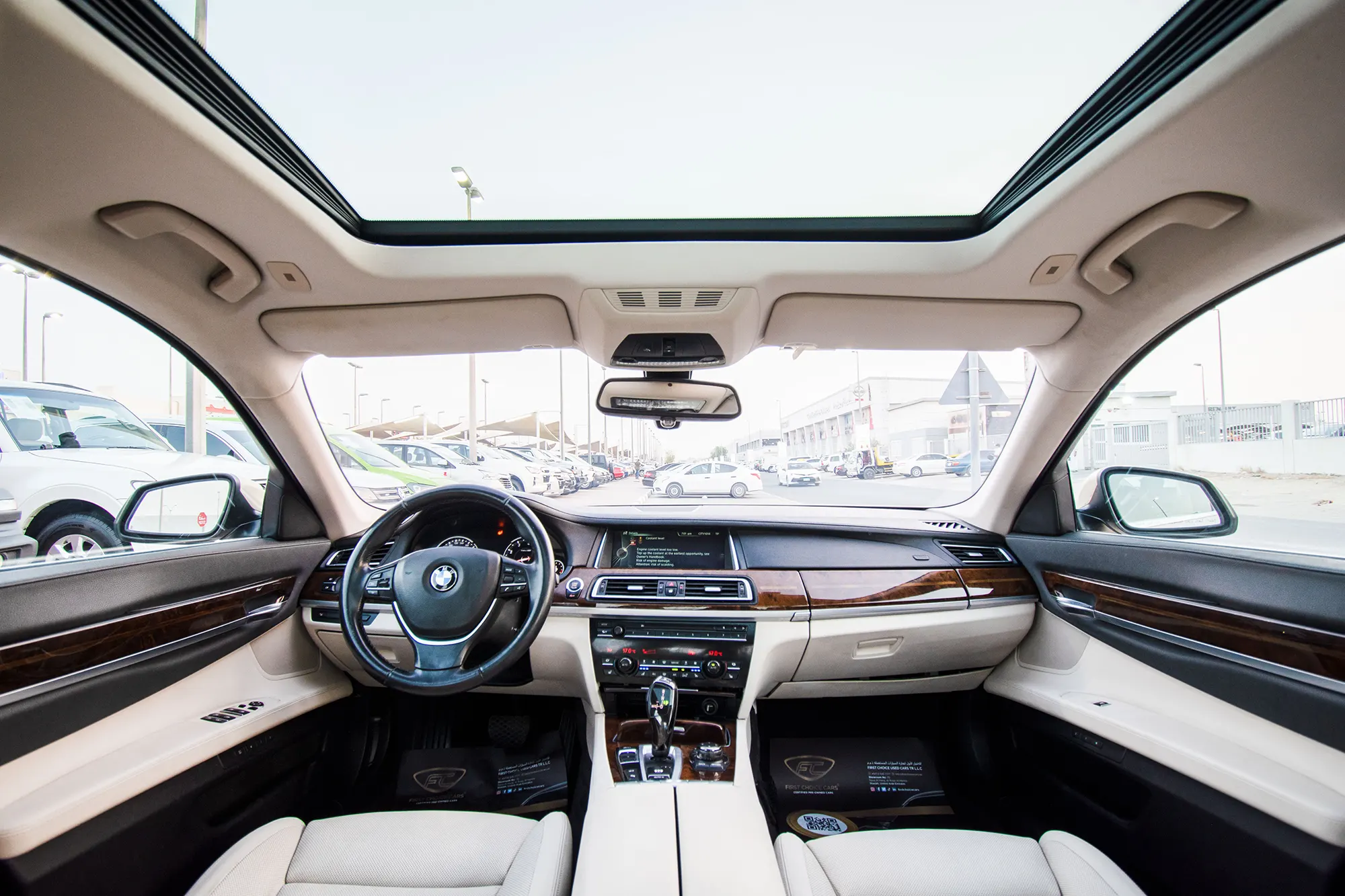 Used 2013 BMW 7-Series 750Li Gold – Driver Side Dashboard & Steering View at First Choice Cars Sharjah