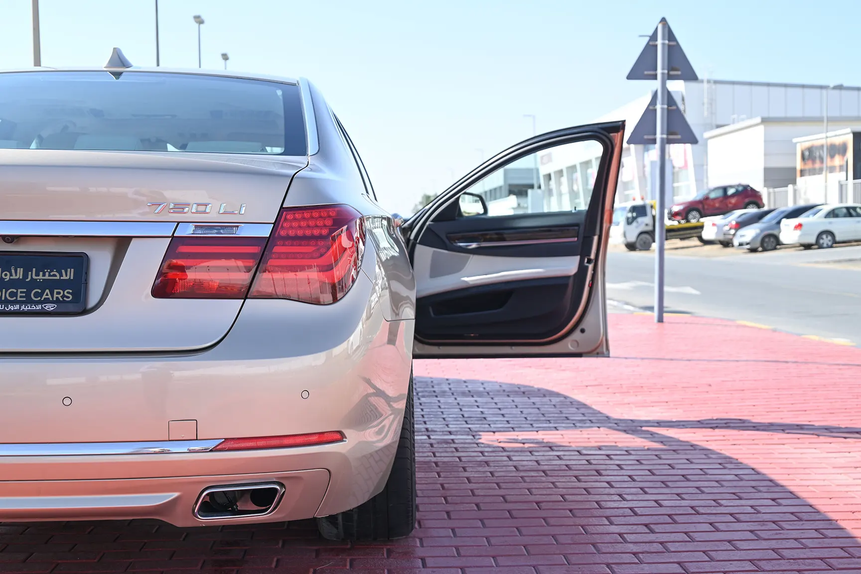 Used 2013 BMW 7-Series 750Li Gold – Rear Left Side with Door Open View at First Choice Cars Sharjah