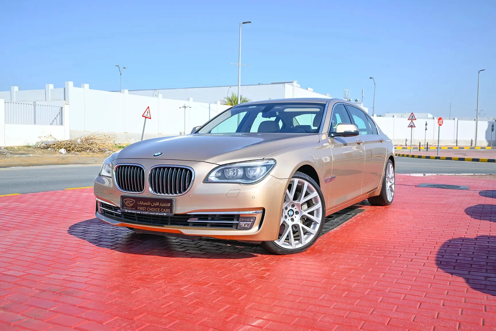 Used 2013 BMW 7-Series 750Li Gold – Left Front Diagonal (45°) View at First Choice Cars Sharjah