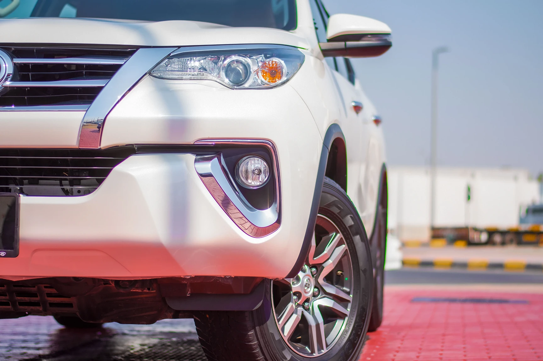 Used 2019 Toyota Fortuner GXR in White – Headlight Close-up for Sale at First Choice Cars Dubai Sharjah