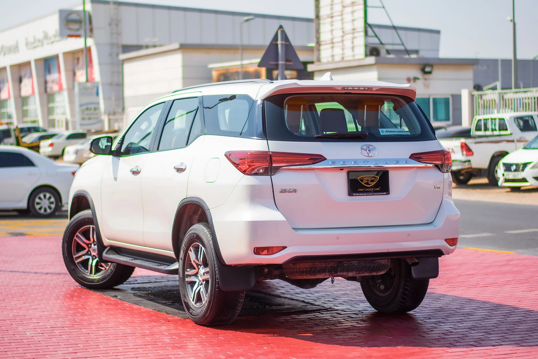 Used 2019 Toyota Fortuner GXR in White – Left Back Diagonal (45°) View for Sale at First Choice Cars Dubai Sharjah