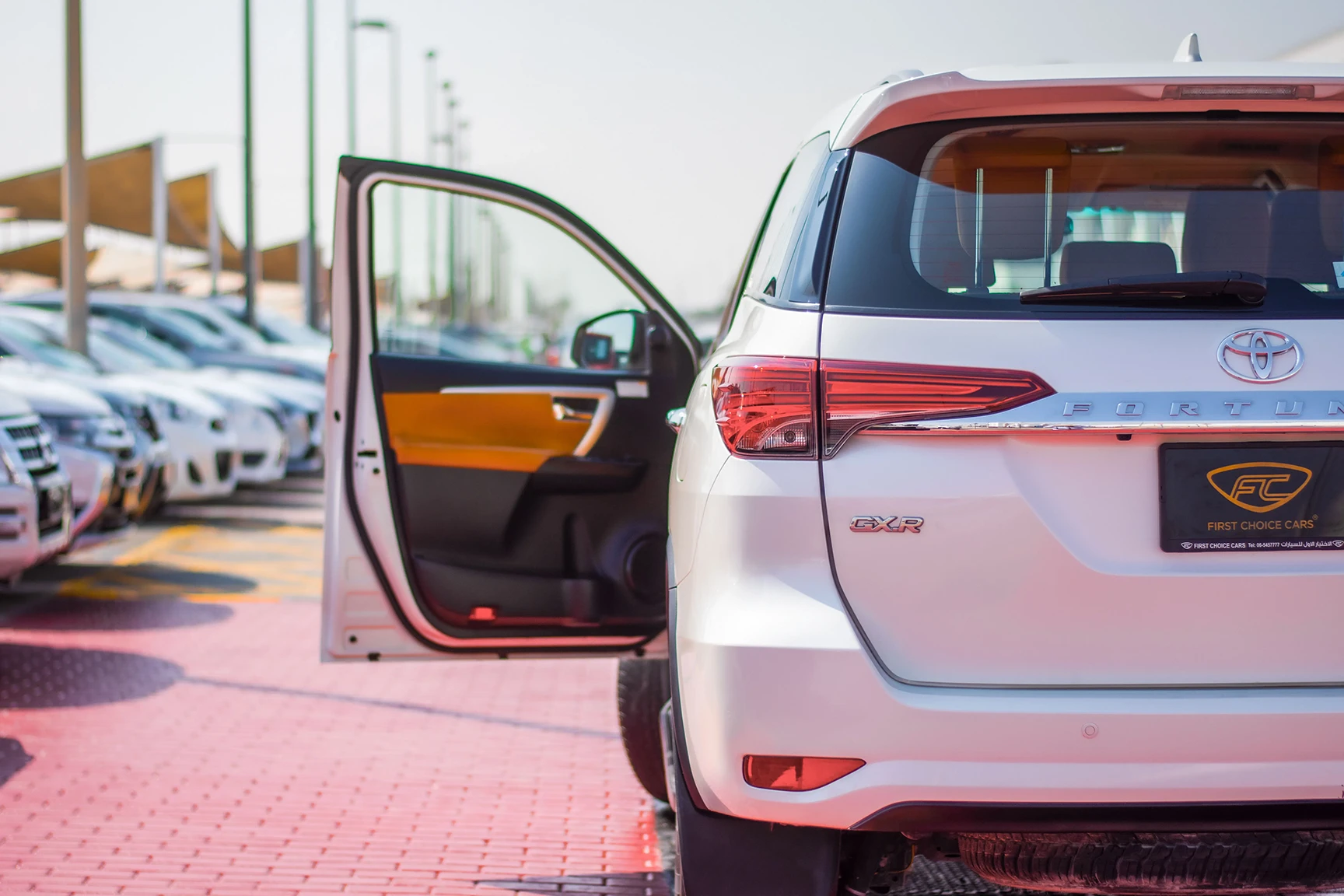 Used 2019 Toyota Fortuner GXR in White – Rear Left Side with Door Open View for Sale at First Choice Cars Dubai Sharjah