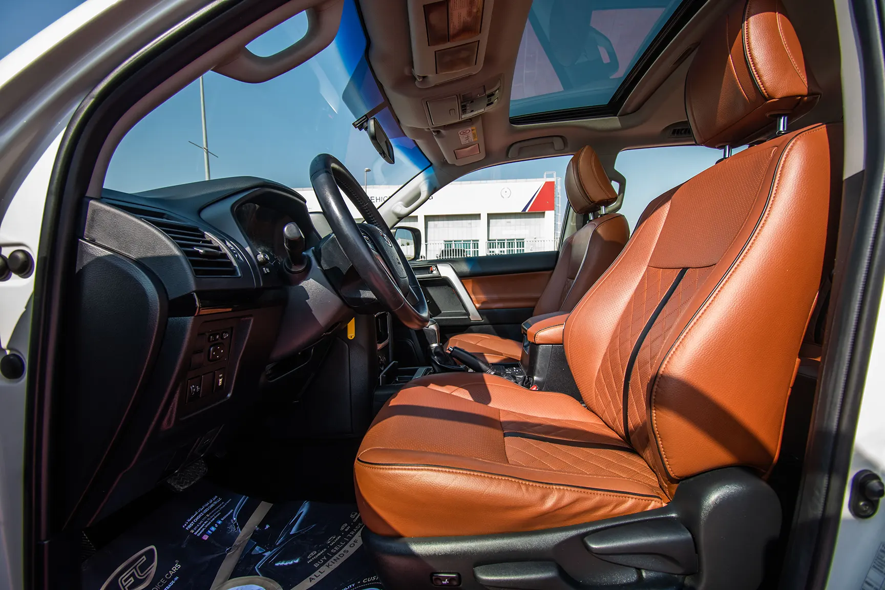 Used 2018 Toyota Prado VXR White – Front Driver Side Cabin View at First Choice Cars Sharjah