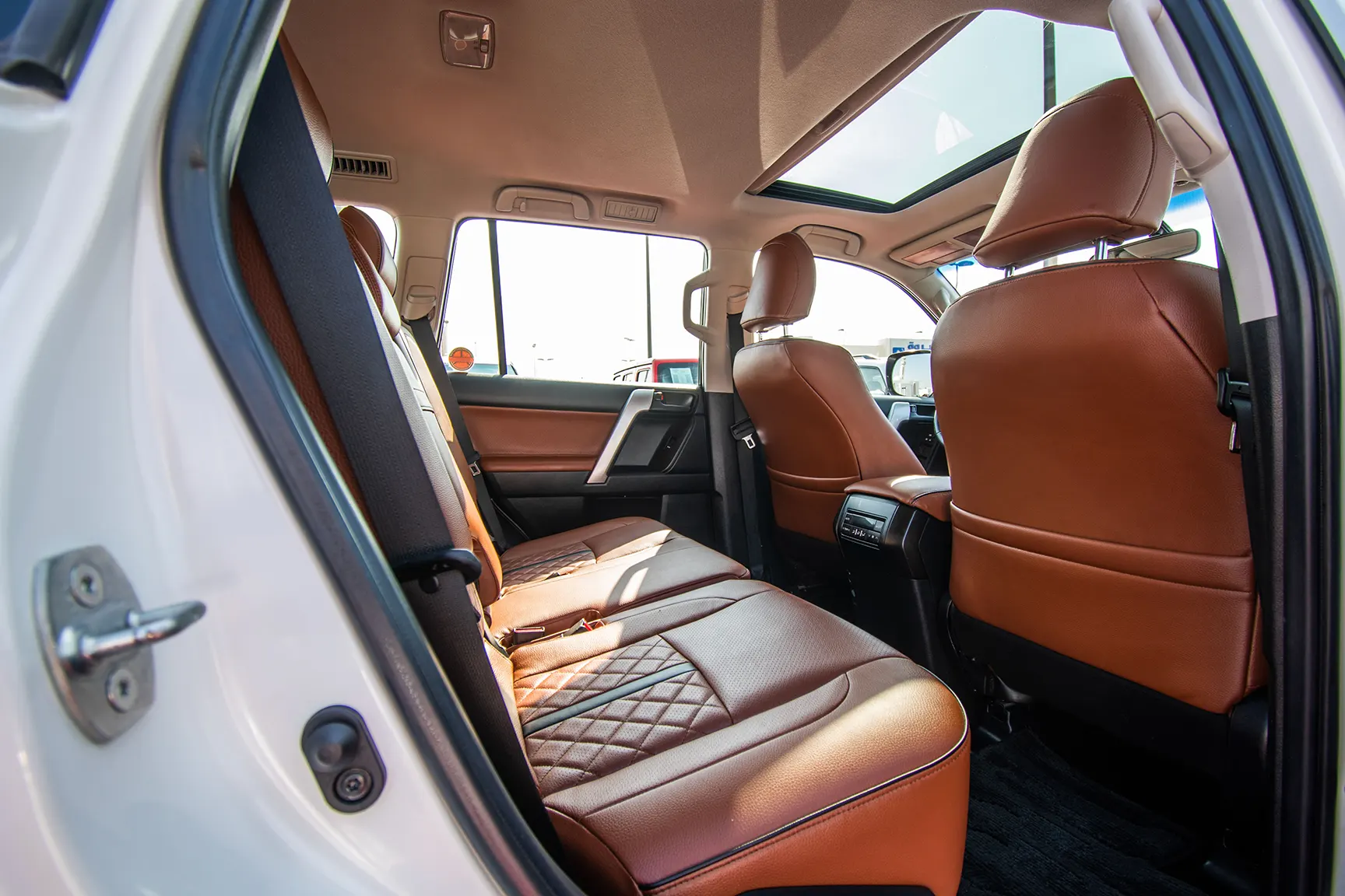 Used 2018 Toyota Prado VXR White – Rear Passenger Side Cabin View at First Choice Cars Sharjah