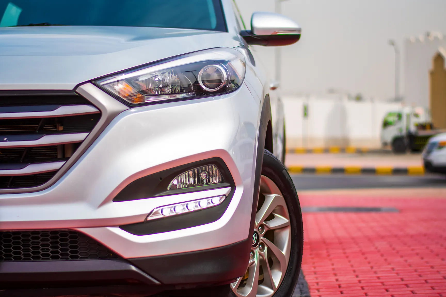 Used 2016 Hyundai Tucson GL White – Headlight Close-up at First Choice Cars Sharjah