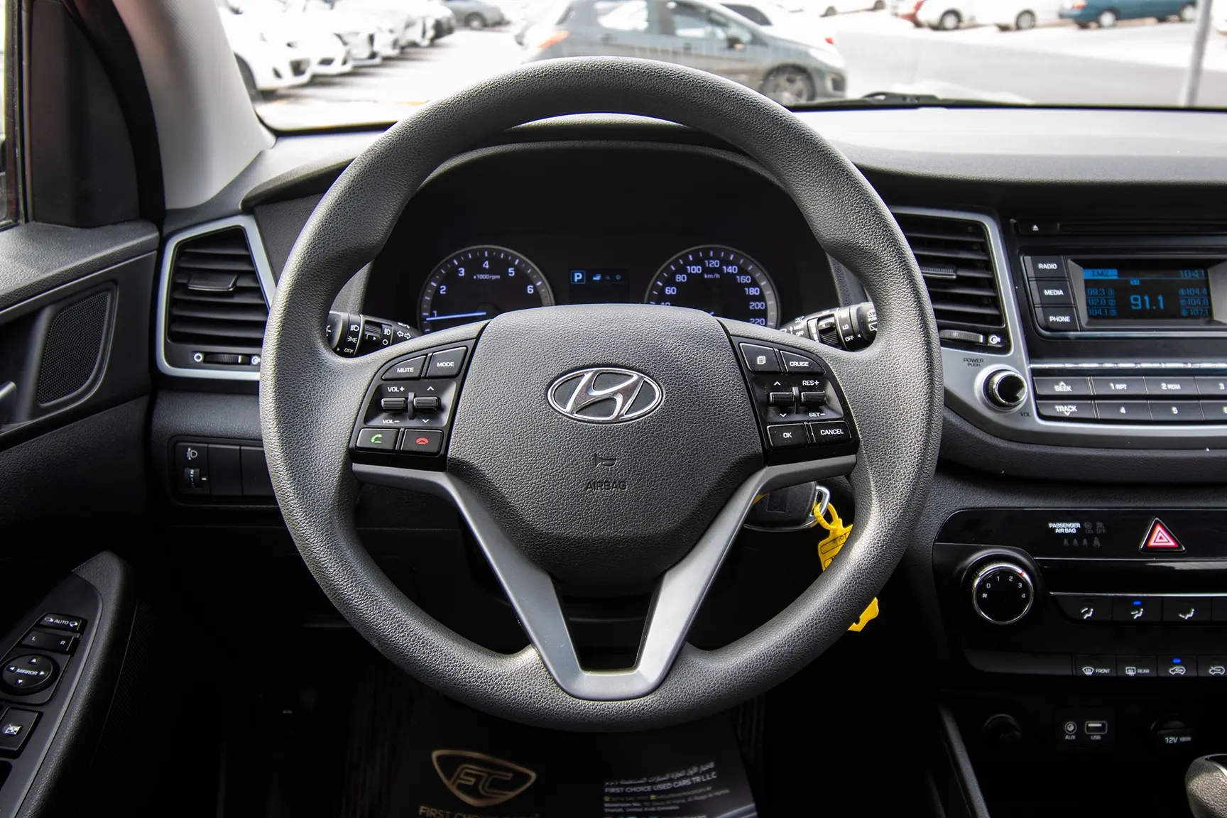 Used 2016 Hyundai Tucson GL White – Driver Side Dashboard & Steering View at First Choice Cars Sharjah