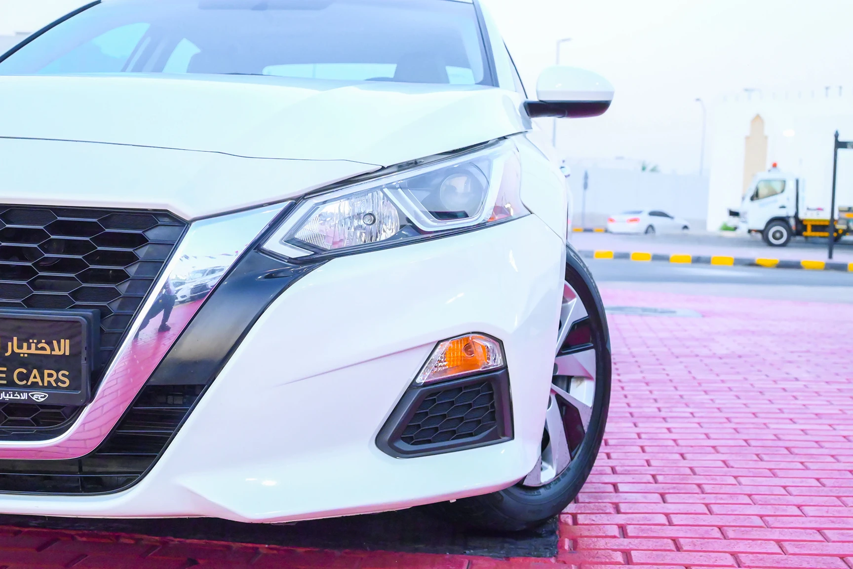 Used 2019 Nissan Altima S White – Headlight Close-up at First Choice Cars Sharjah