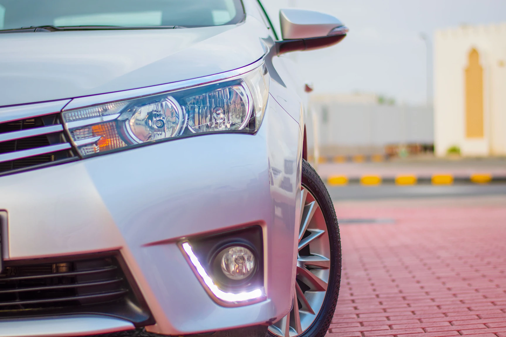 Used 2015 Toyota Corolla Se Silver – Headlight Close-up at First Choice Cars Sharjah