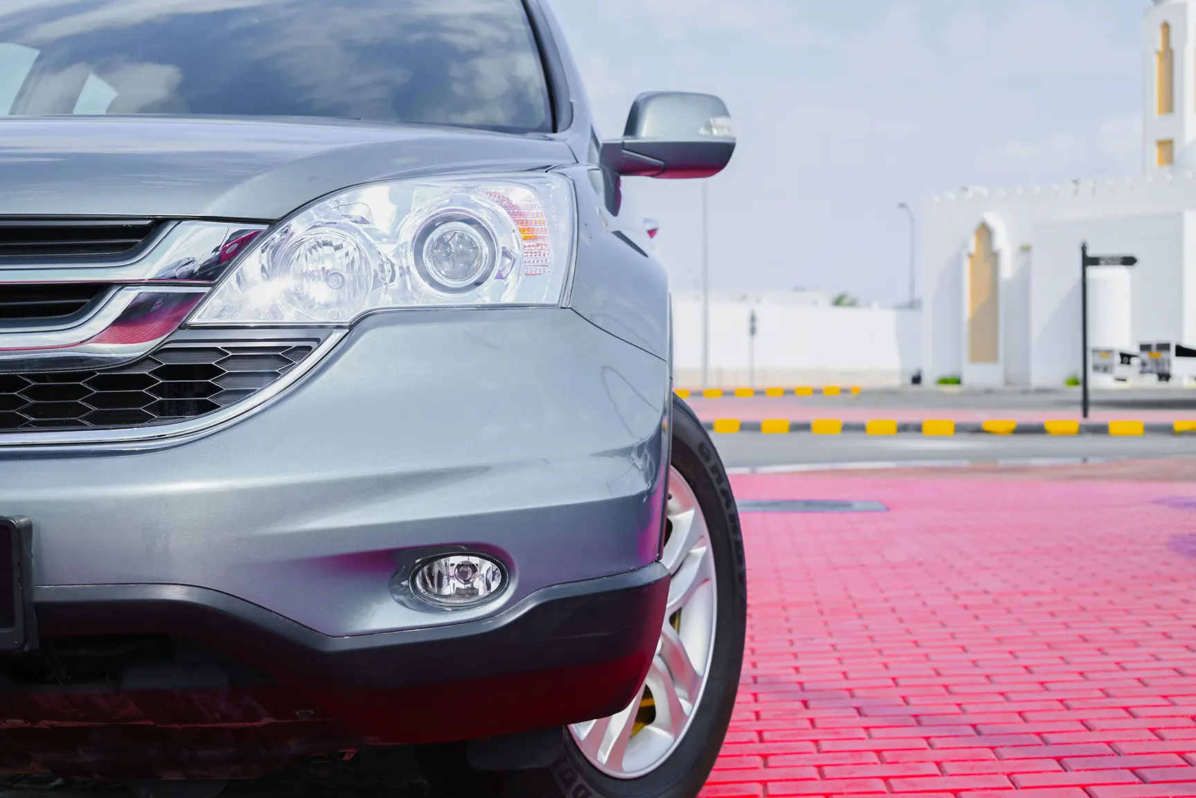 Used 2011 Honda CR-V EXL in Silver – Headlight Close-up for Sale at First Choice Cars Dubai Sharjah