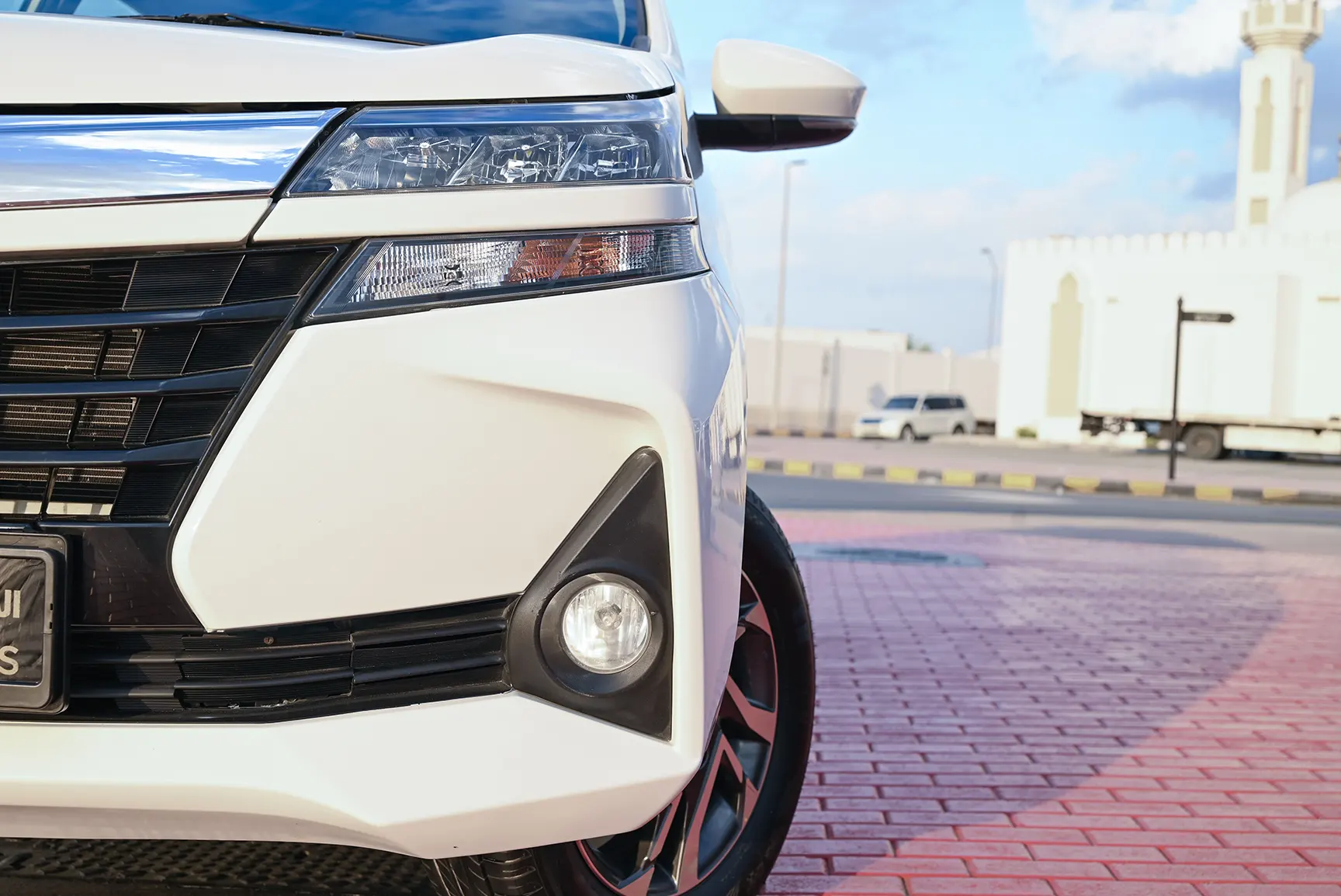 Used 2020 Toyota Avanza SE White – Headlight Close-up at First Choice Cars Sharjah