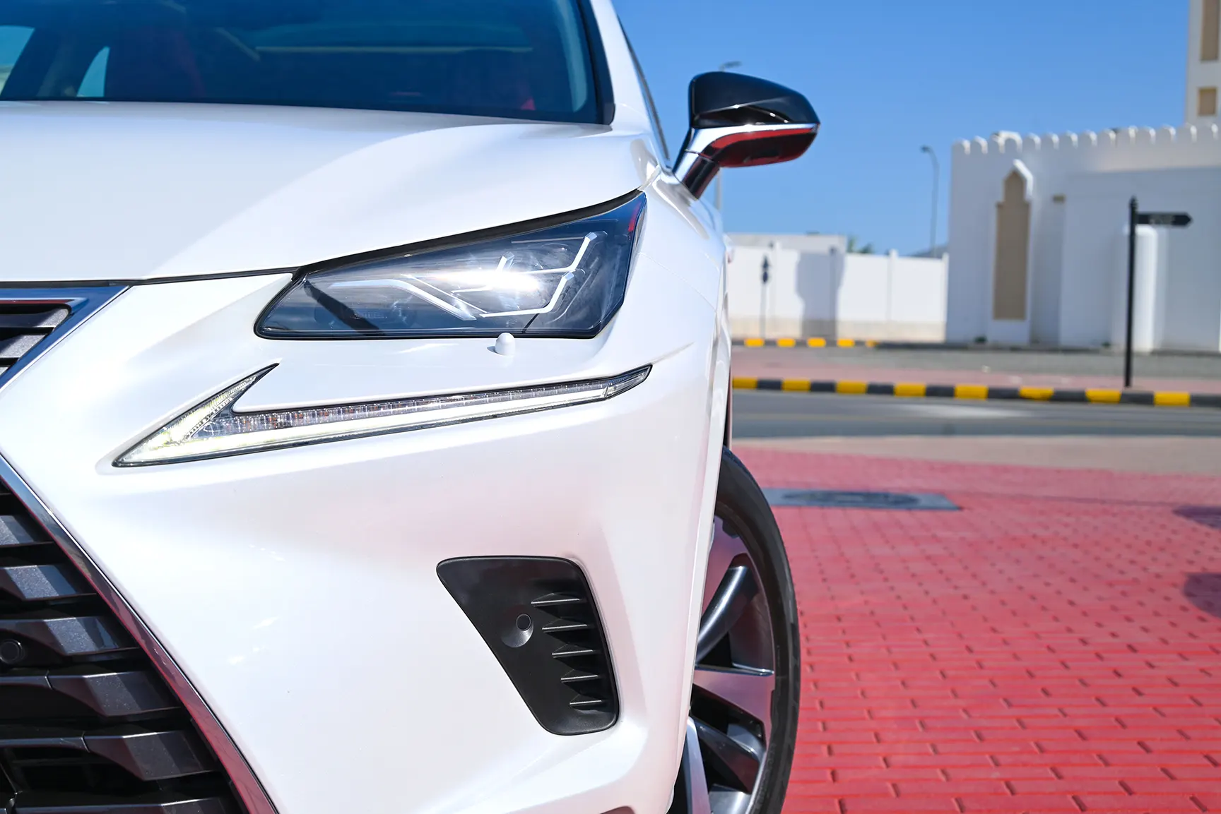 Used 2020 Lexus NX-SERIES NX 300 Platinum White – Headlight Close-up at First Choice Cars Sharjah