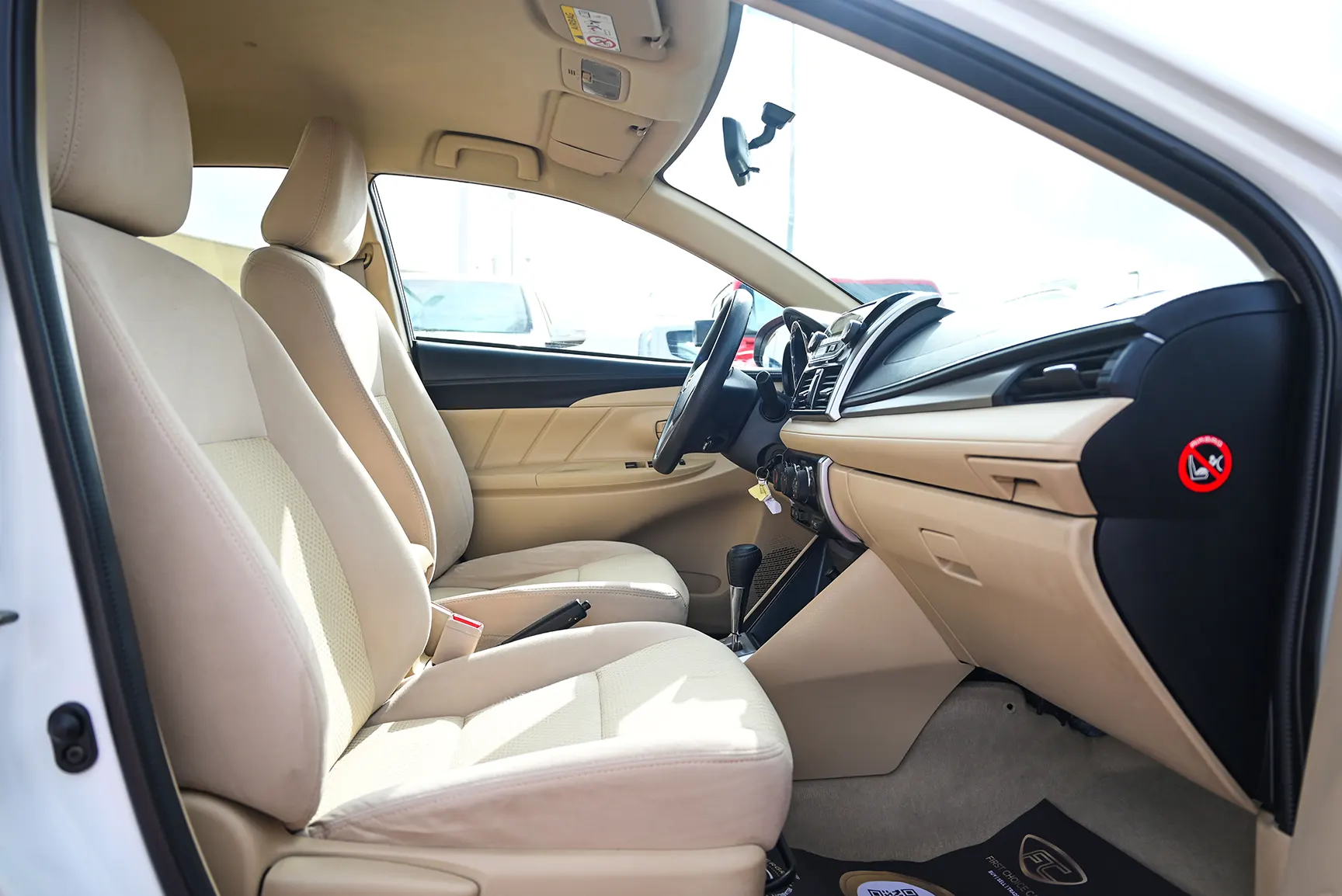 Used 2017 Toyota Yaris Se White – Front Passenger Side Cabin View at First Choice Cars Sharjah