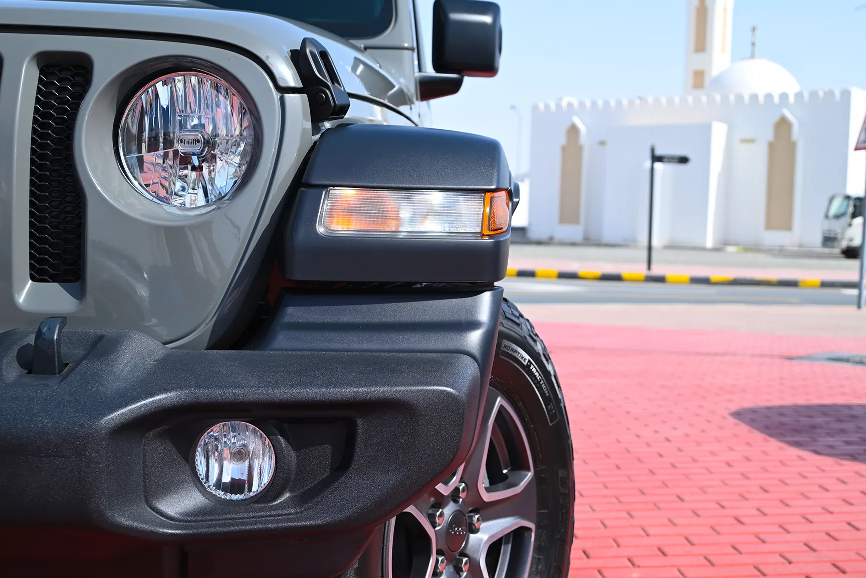 Used 2021 Jeep Wrangler Sport Grey – Headlight Close-up at First Choice Cars Sharjah
