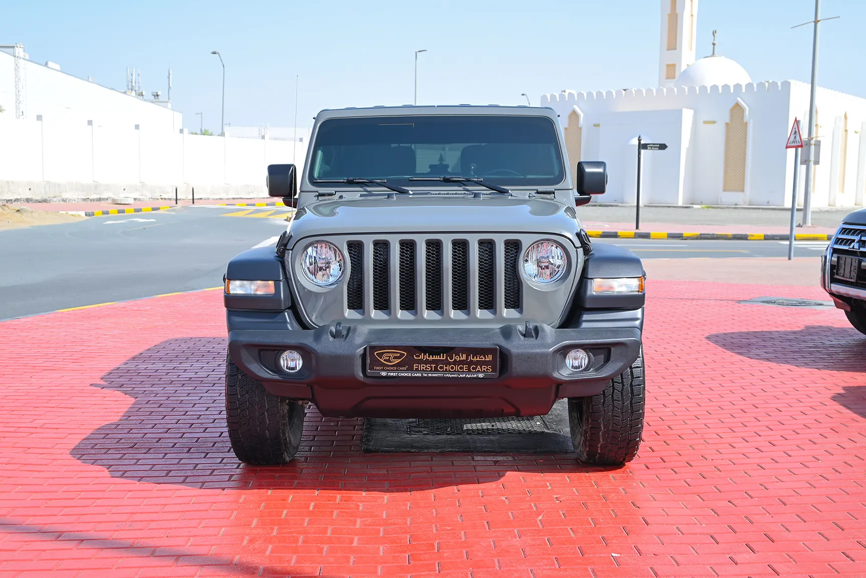 Used 2021 Jeep Wrangler Sport Grey – Front View at First Choice Cars Sharjah