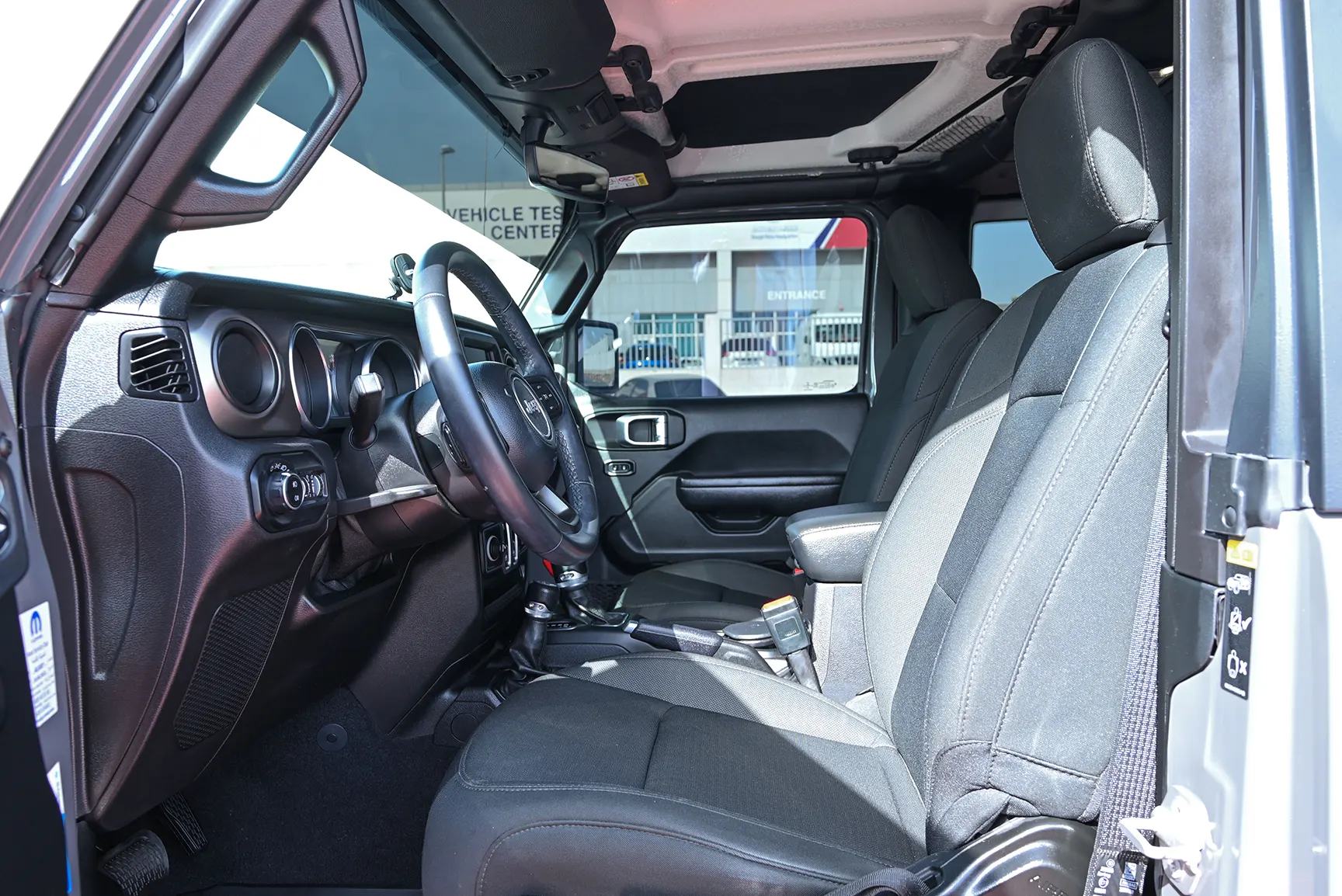 Used 2021 Jeep Wrangler Sport Grey – Front Driver Side Cabin View at First Choice Cars Sharjah