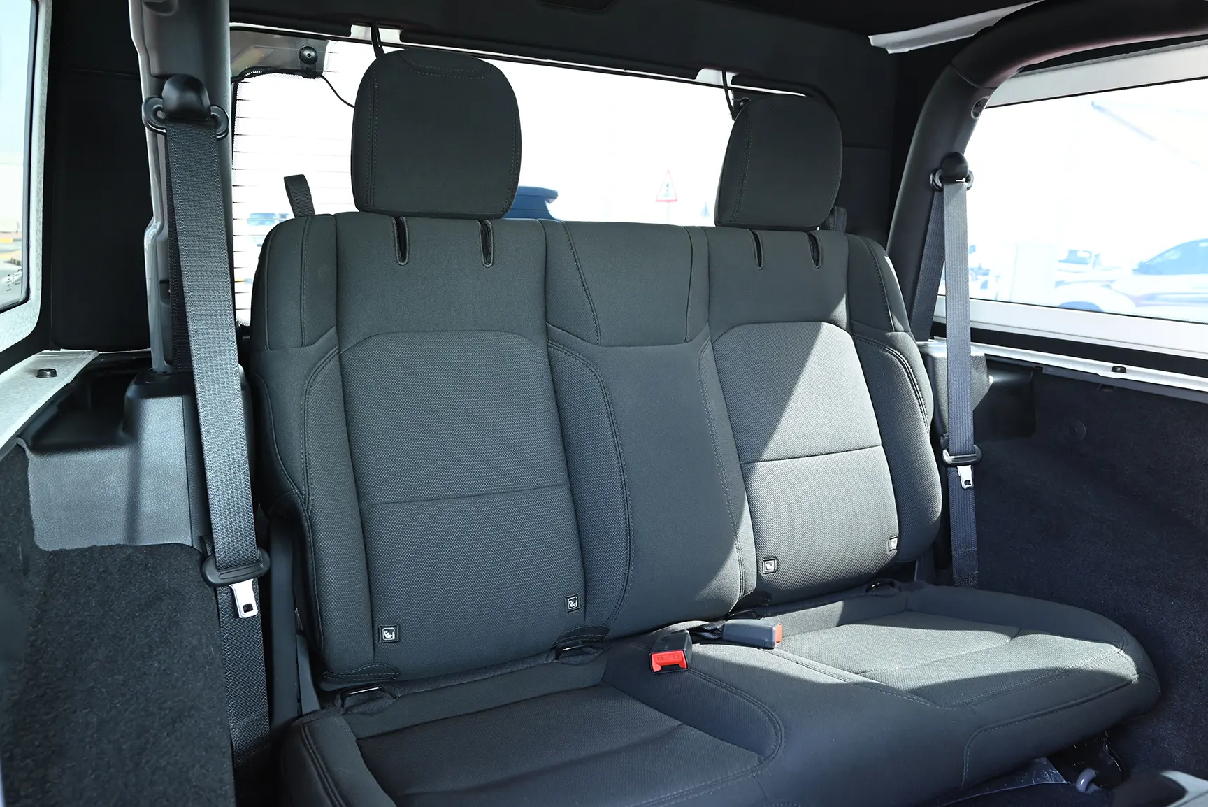 Used 2021 Jeep Wrangler Sport Grey – Rear Driver Side Cabin View at First Choice Cars Sharjah