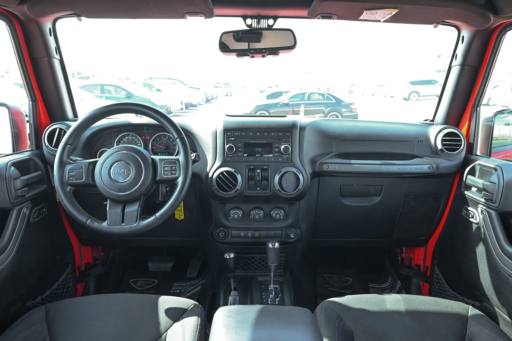 Used 2016 Jeep Wrangler Unlimited Sport Red – Front Cabin / Dashboard Full View at First Choice Cars Sharjah