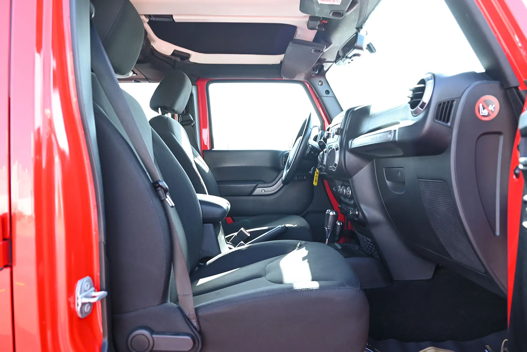 Used 2016 Jeep Wrangler Unlimited Sport Red – Front Passenger Side Cabin View at First Choice Cars Sharjah