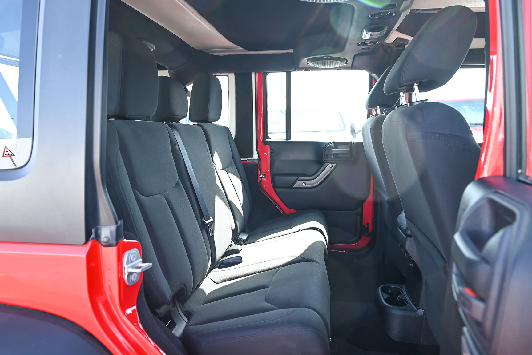 Used 2016 Jeep Wrangler Unlimited Sport Red – Rear Passenger Side Cabin View at First Choice Cars Sharjah
