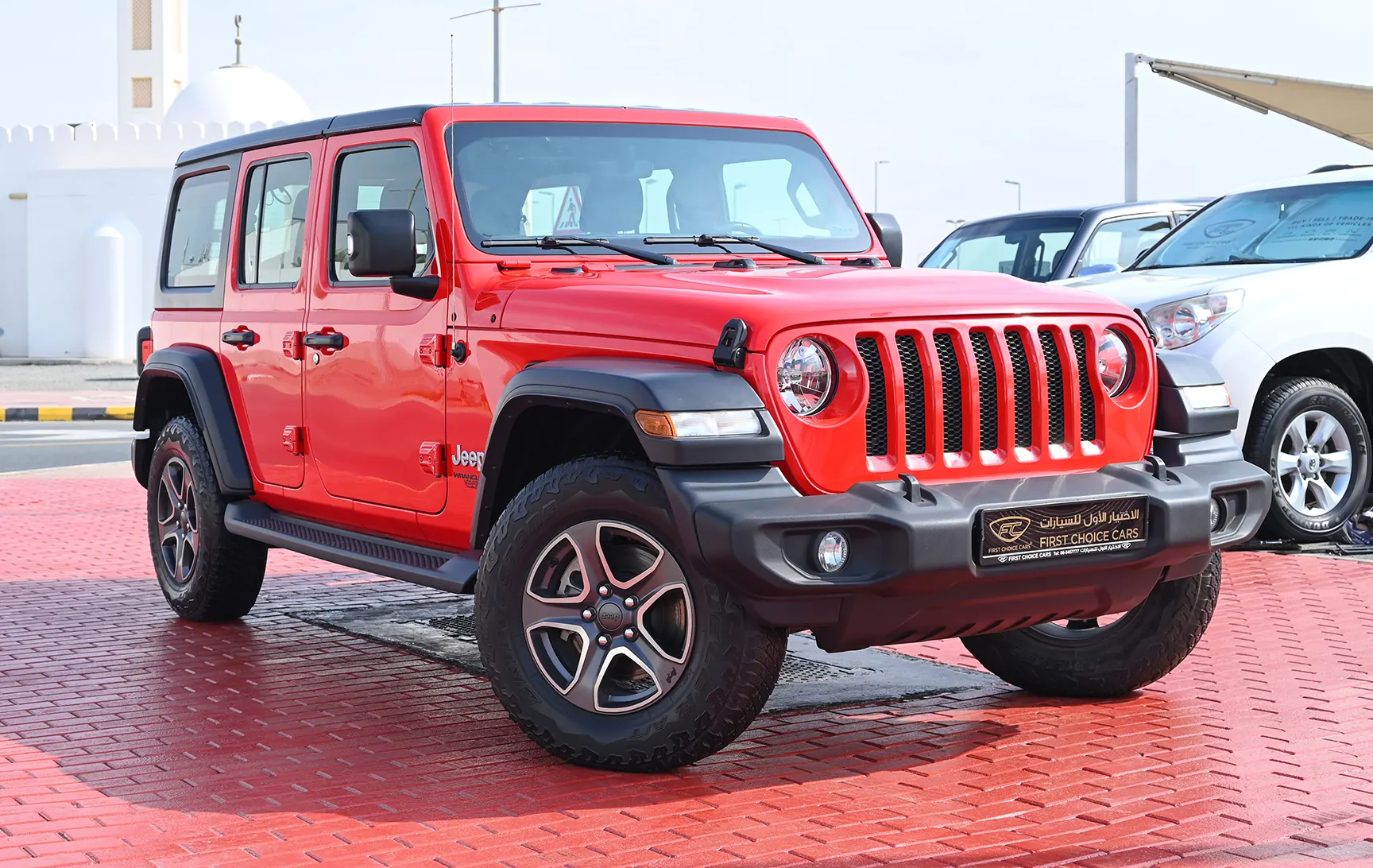 Used 2019 Jeep Wrangler Unlimited Sport Red – Right Front Diagonal (45°) View at First Choice Cars Sharjah