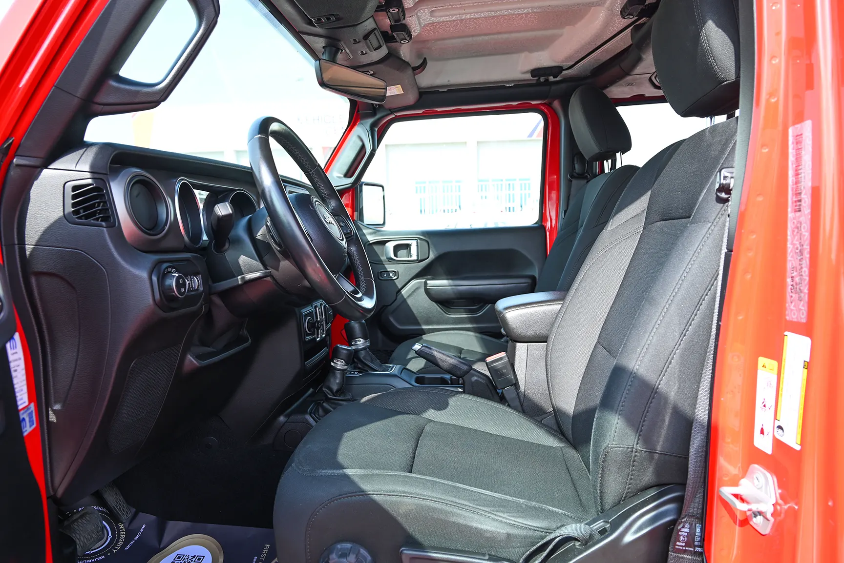 Used 2019 Jeep Wrangler Unlimited Sport Red – Front Driver Side Cabin View at First Choice Cars Sharjah