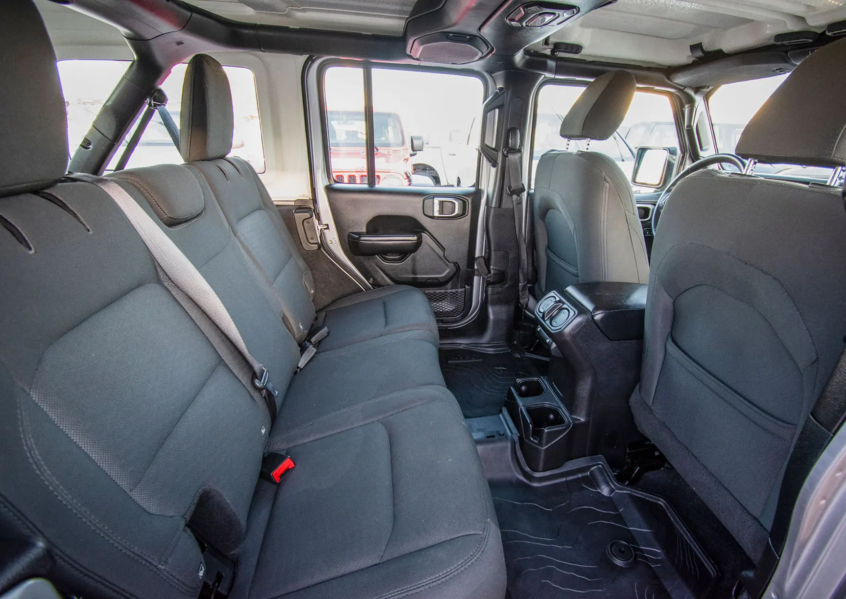 Used 2019 Jeep Wrangler Unlimited Sport Silver – Rear Passenger Side Cabin View at First Choice Cars Sharjah