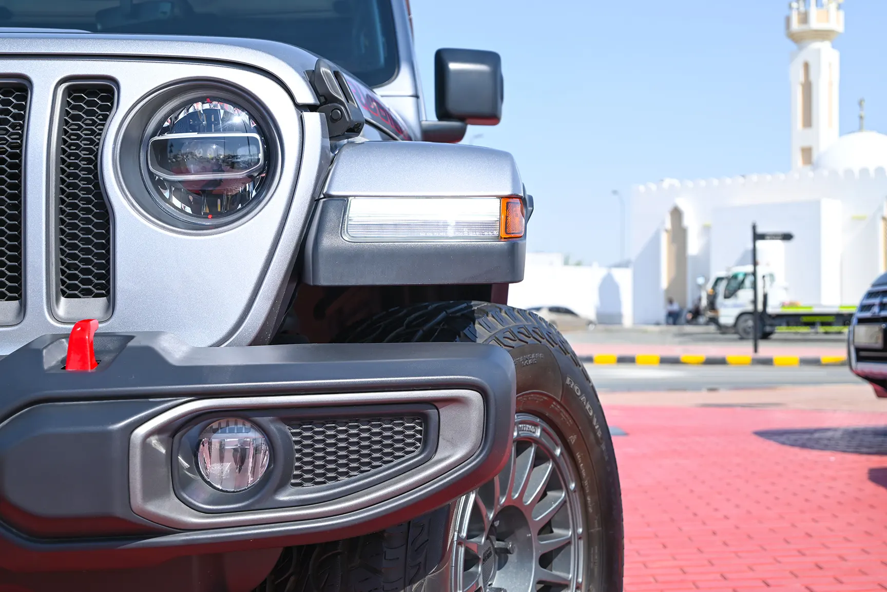 Used 2020 Jeep Wrangler Unlimited Rubicon Silver – Headlight Close-up at First Choice Cars Sharjah