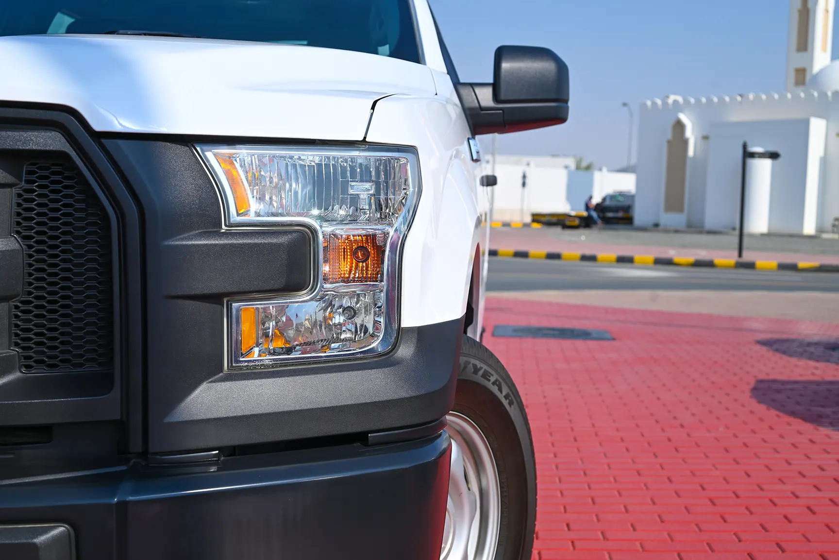 Used 2015 Ford F-Series Pickup F-150 XLT White – Headlight Close-up at First Choice Cars Sharjah