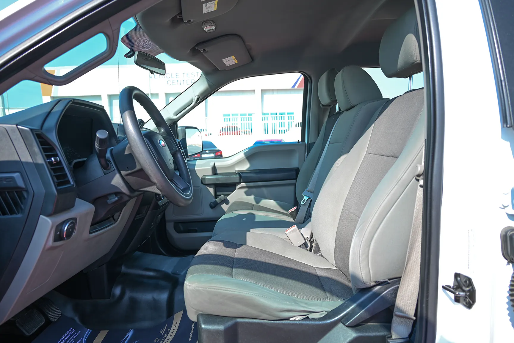 Used 2015 Ford F-Series Pickup F-150 XLT White – Front Driver Side Cabin View at First Choice Cars Sharjah