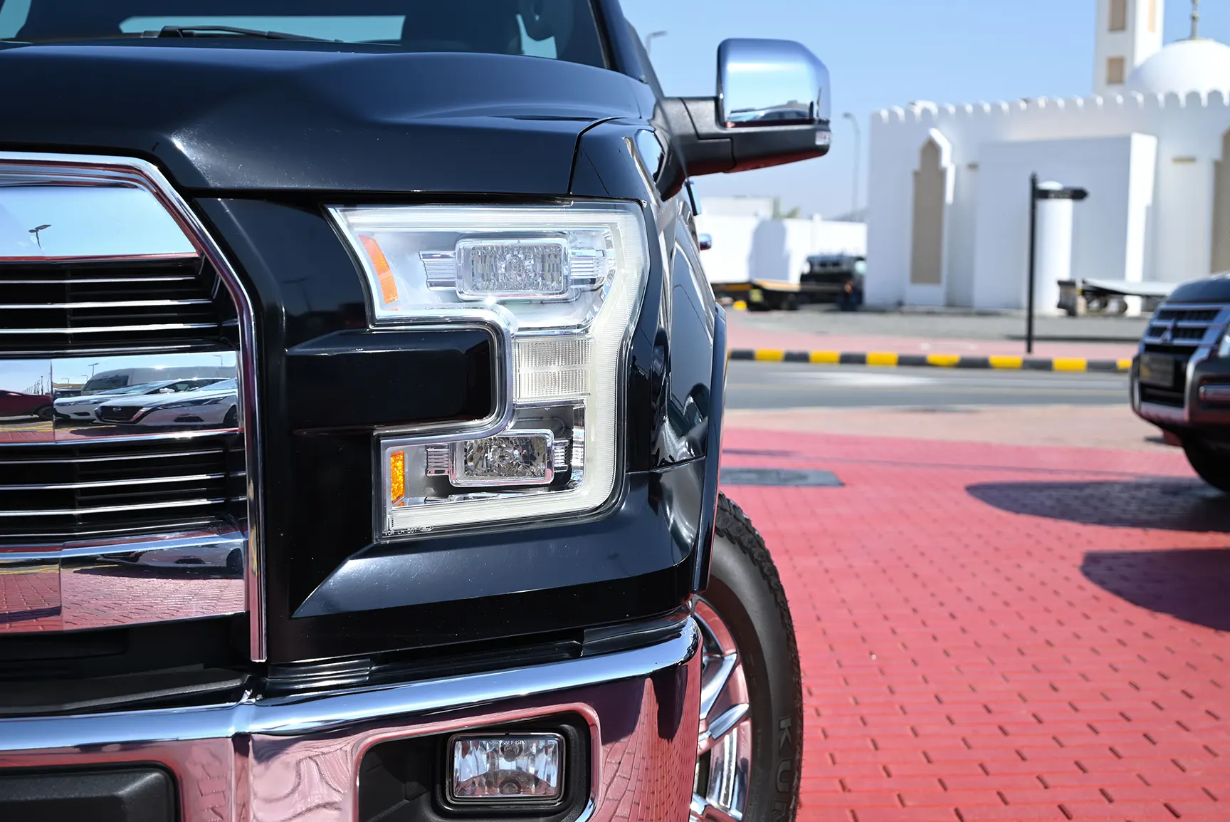 Used 2017 Ford F-Series Pickup F-150 Lariat Sport Edition in Black – Headlight Close-up for Sale at First Choice Cars Dubai Sharjah