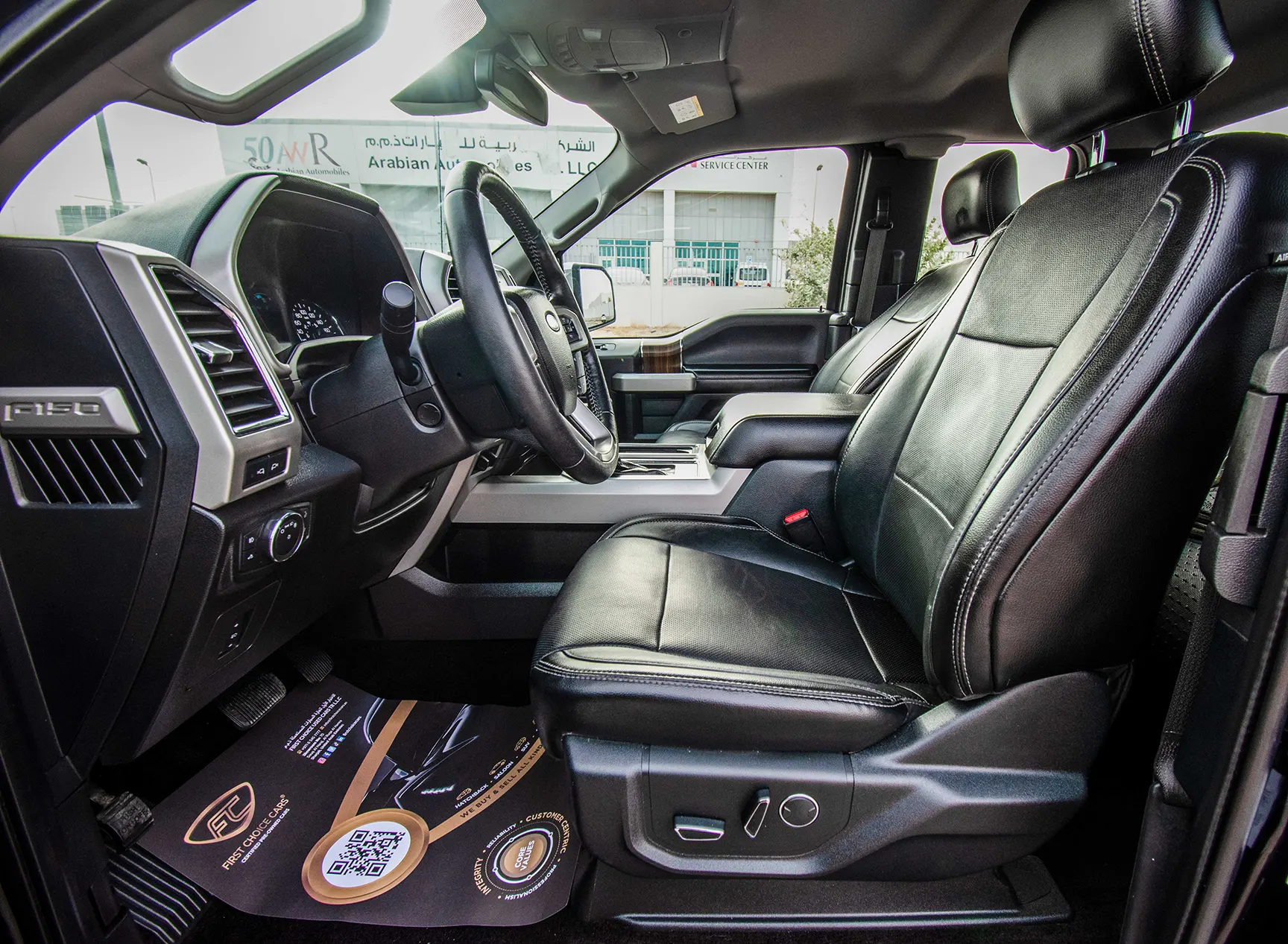 Used 2017 Ford F-Series Pickup F-150 Lariat Sport Edition in Black – Front Driver Side Cabin View for Sale at First Choice Cars Dubai Sharjah