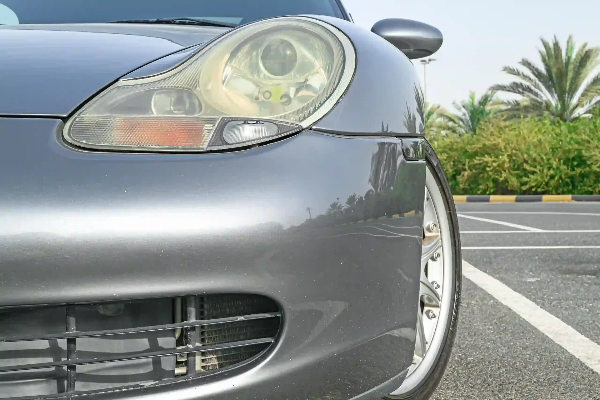 Used 2004 Porsche Boxster S Variant in Silver – Headlight Close-up for Sale at First Choice Cars Dubai Sharjah