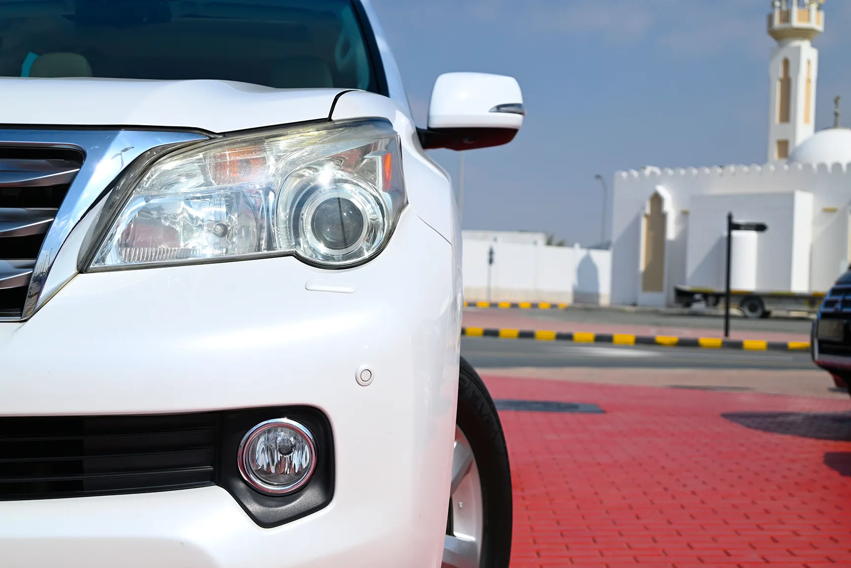 Used 2010 Lexus GX-Series GX 460 Platinum White – Headlight Close-up at First Choice Cars Sharjah