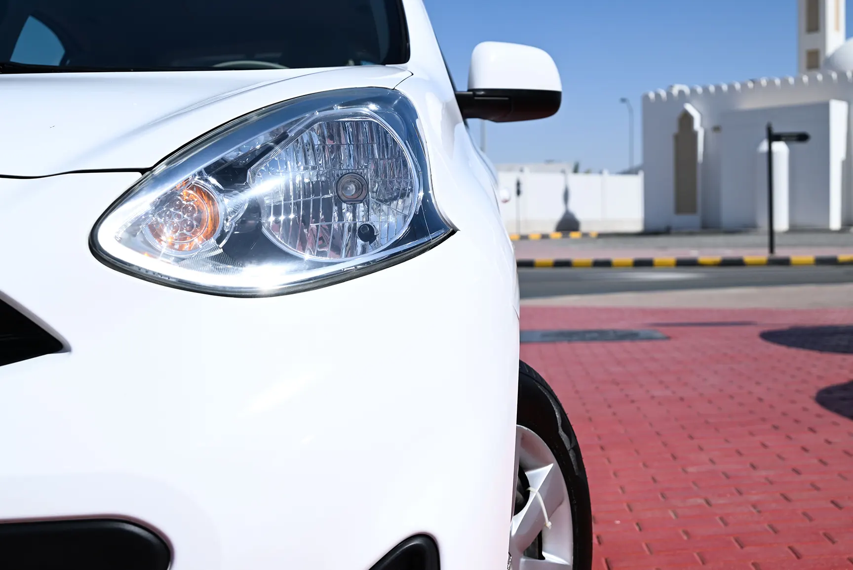 Used 2020 Nissan Micra S White – Headlight Close-up at First Choice Cars Sharjah