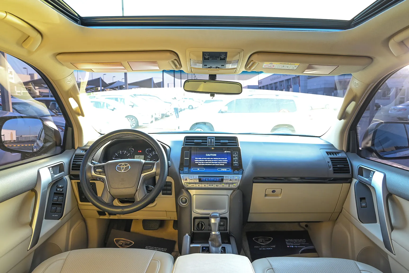 Used 2021 Toyota Prado GXR White – Front Cabin / Dashboard Full View at First Choice Cars Sharjah