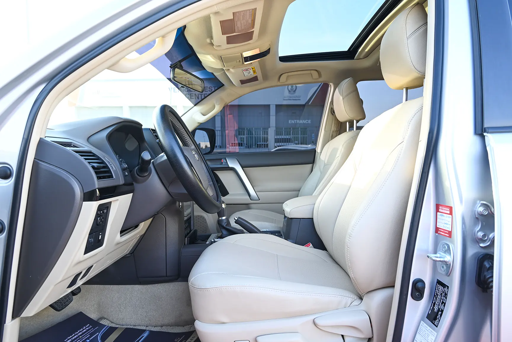 Used 2021 Toyota Prado GXR White – Front Driver Side Cabin View at First Choice Cars Sharjah