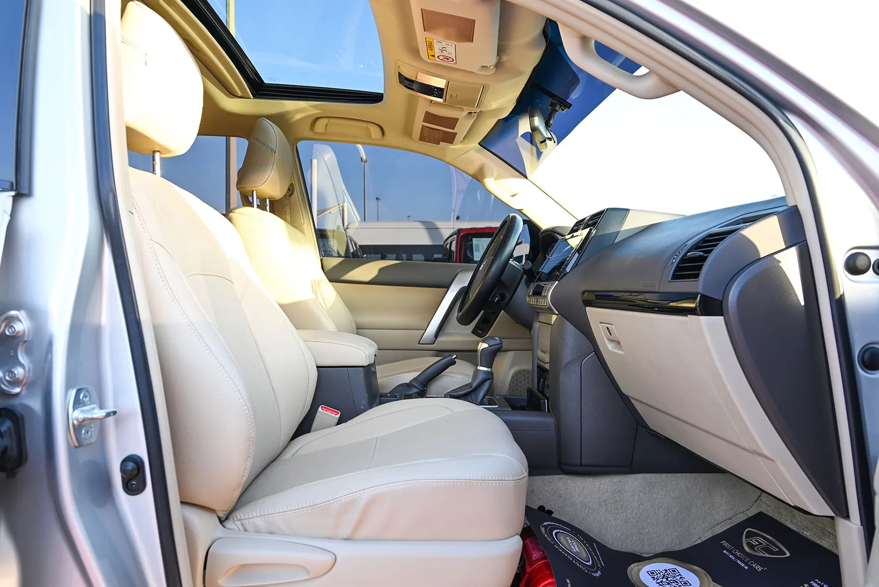 Used 2021 Toyota Prado GXR White – Front Passenger Side Cabin View at First Choice Cars Sharjah