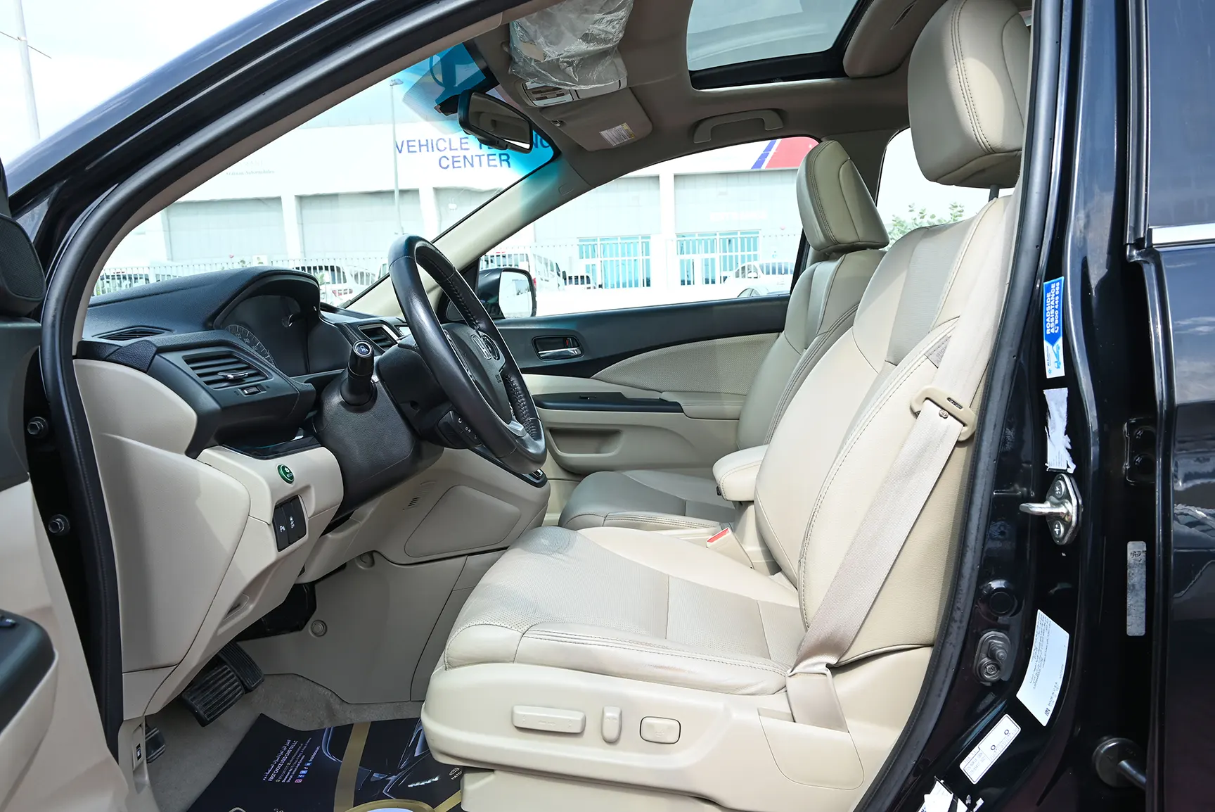 Used 2016 Honda CR-V EXL in Black – Front Driver Side Cabin View for Sale at First Choice Cars Dubai Sharjah