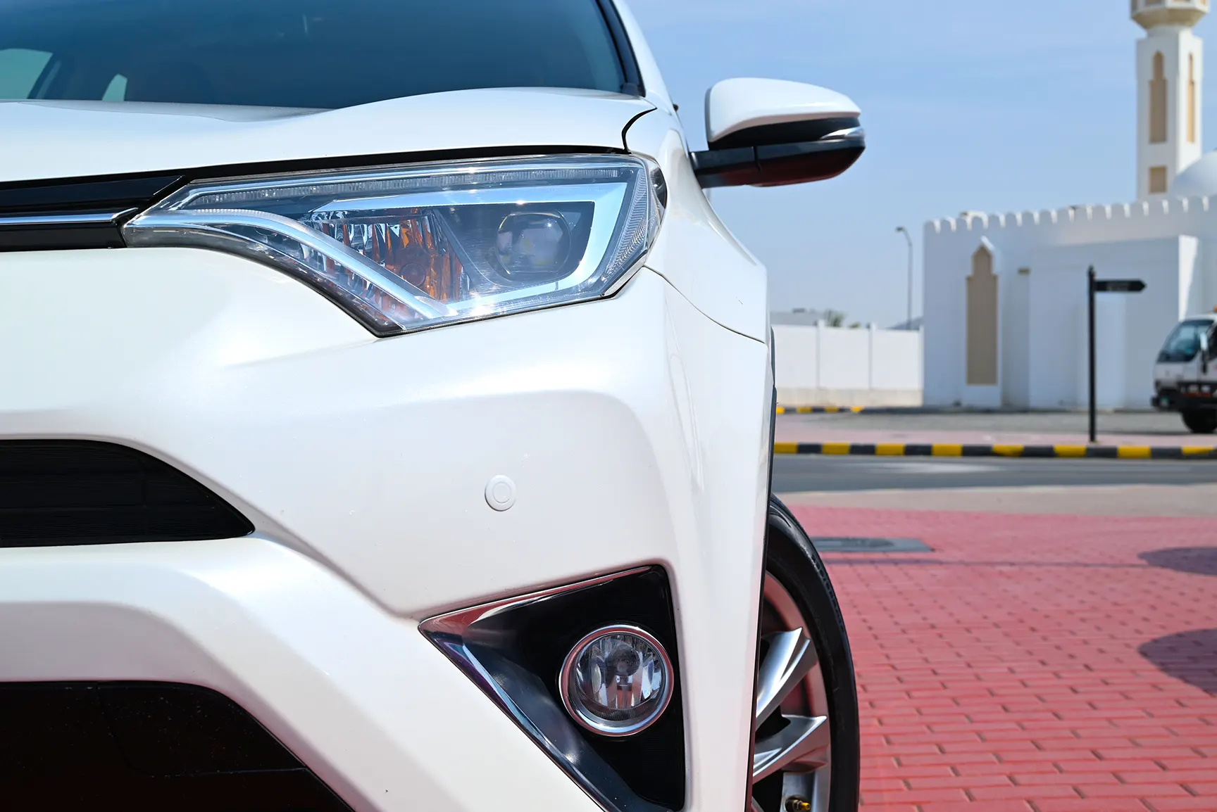 Used 2017 Toyota RAV4 VXR in White – Headlight Close-up for Sale at First Choice Cars Dubai Sharjah