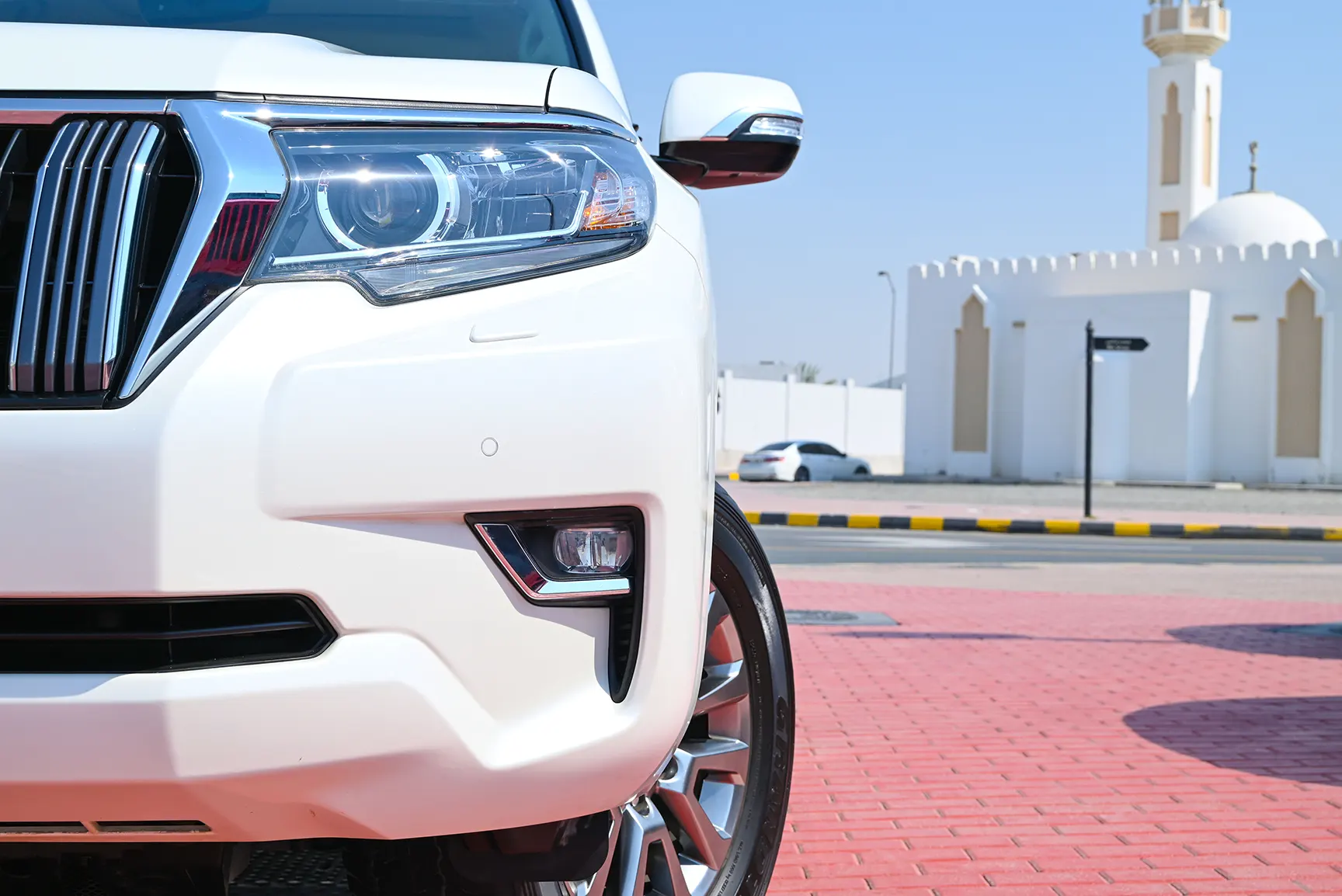 Used 2019 Toyota Prado Limited White – Headlight Close-up at First Choice Cars Sharjah