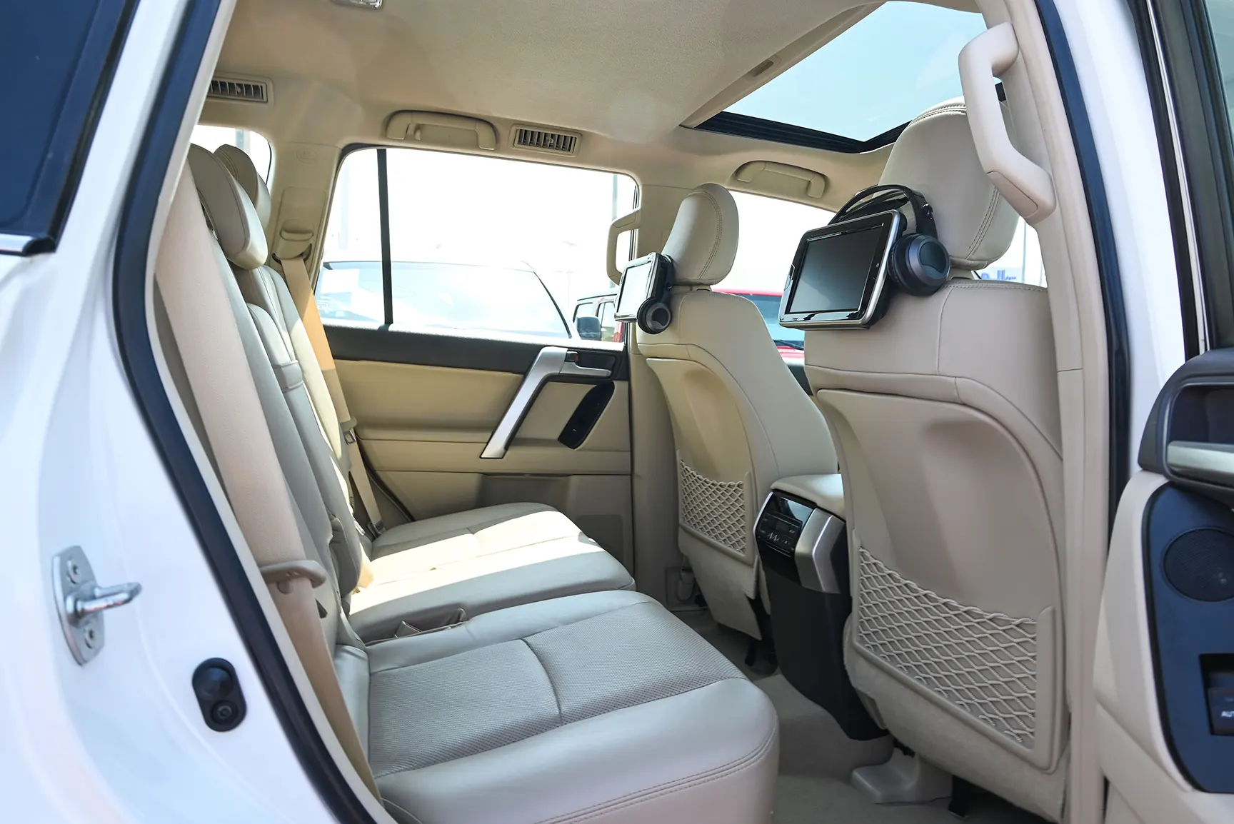 Used 2019 Toyota Prado Limited White – Rear Passenger Side Cabin View at First Choice Cars Sharjah