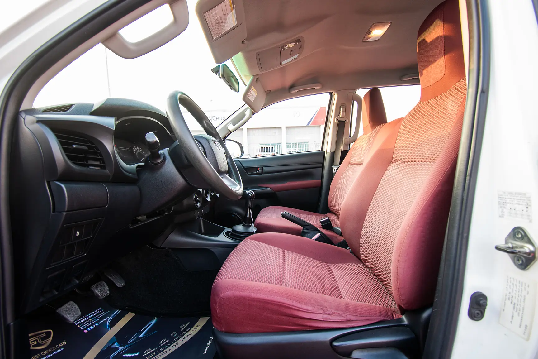 Used 2017 Toyota Hilux DLS Double Cabin White – Front Driver Side Cabin View at First Choice Cars Sharjah