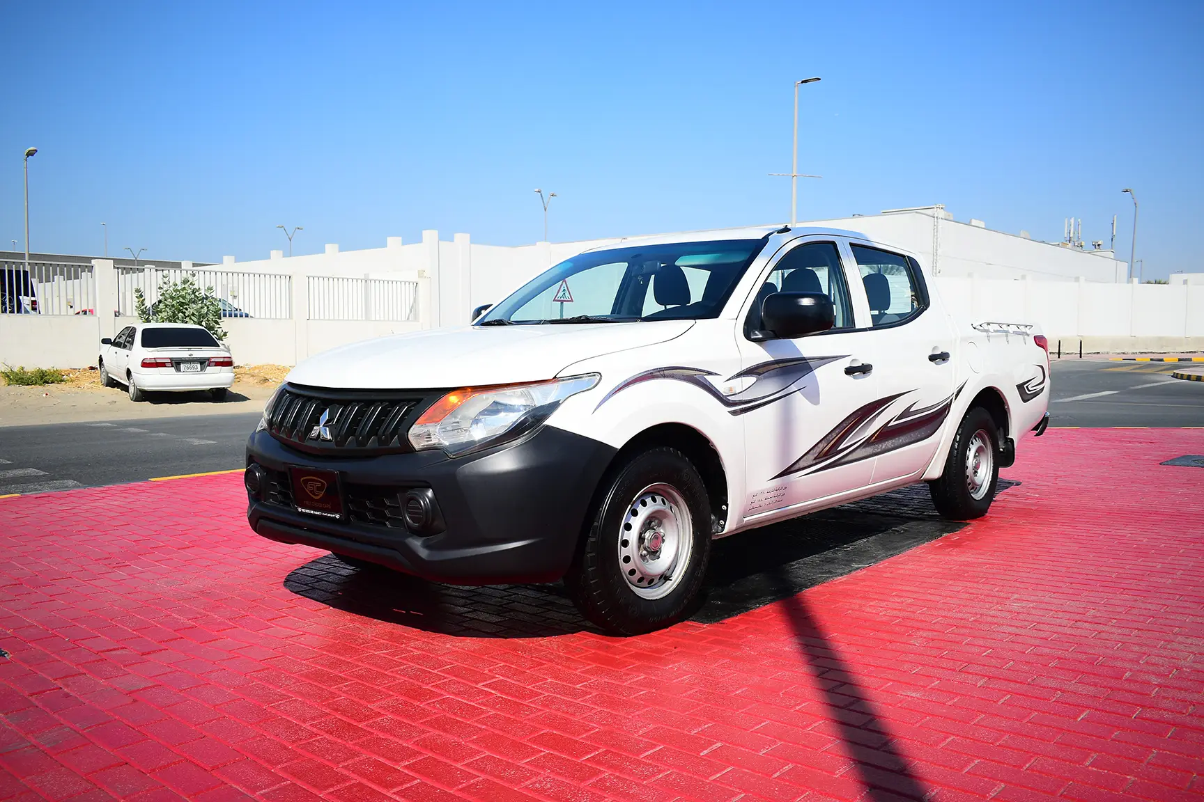 Used 2016 Mitsubishi L200 GL Double Cabin White – Left Front Diagonal (45°) View at First Choice Cars Sharjah