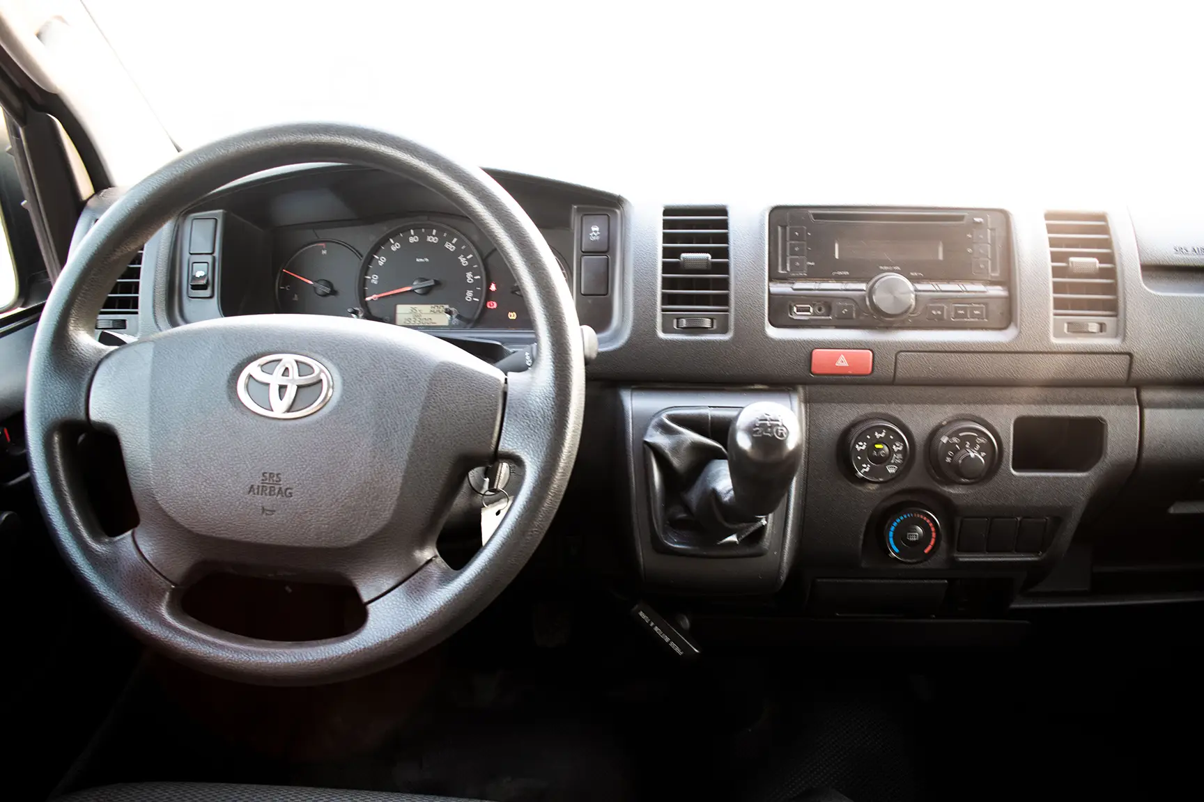 Used 2017 Toyota Hiace GL Standard Roof in White – Front Cabin / Dashboard Full View for Sale at First Choice Cars Dubai Sharjah