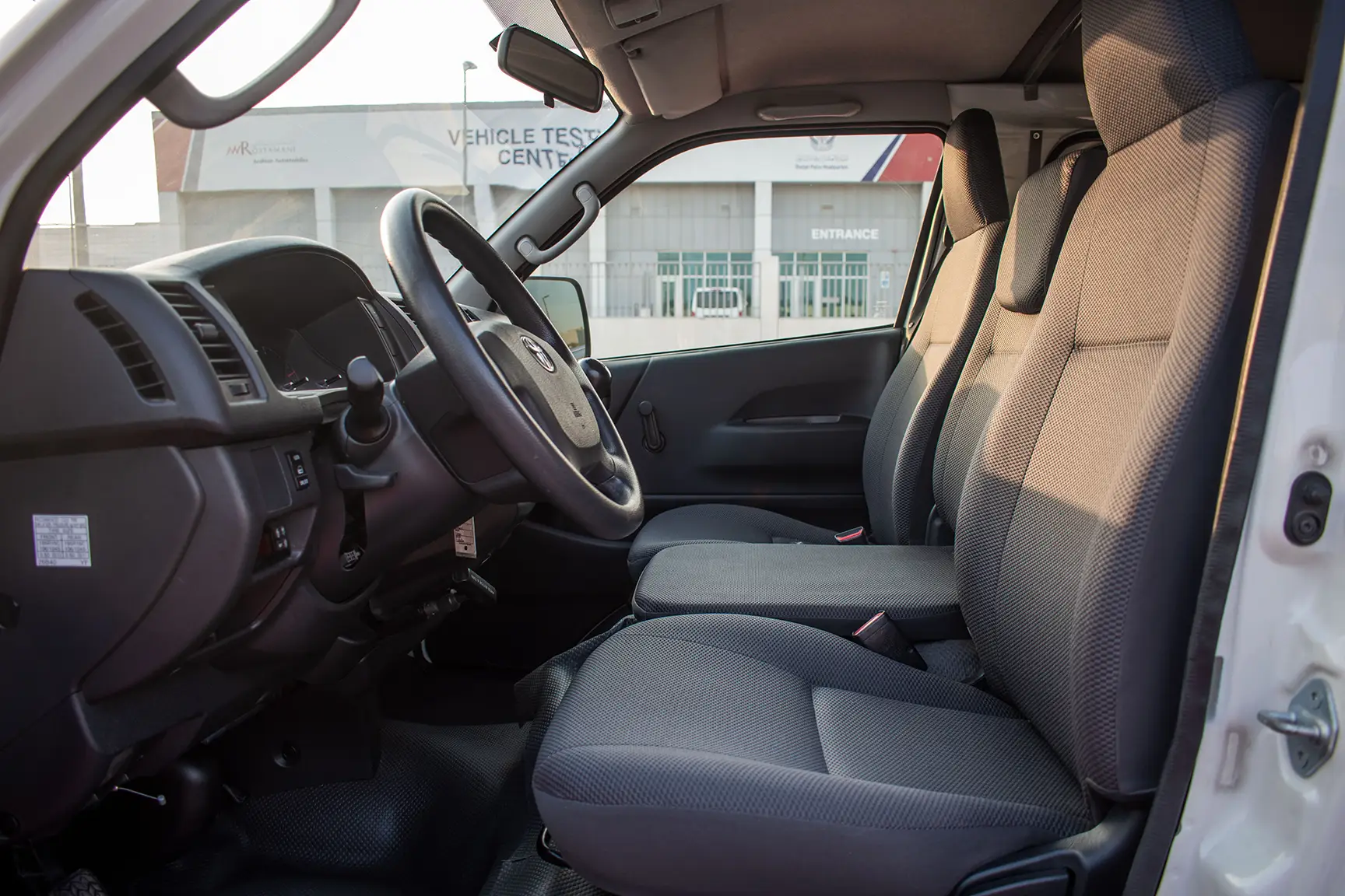 Used 2017 Toyota Hiace GL -Std Roof 6 STR Panel Van White – Front Driver Side Cabin View at First Choice Cars Sharjah