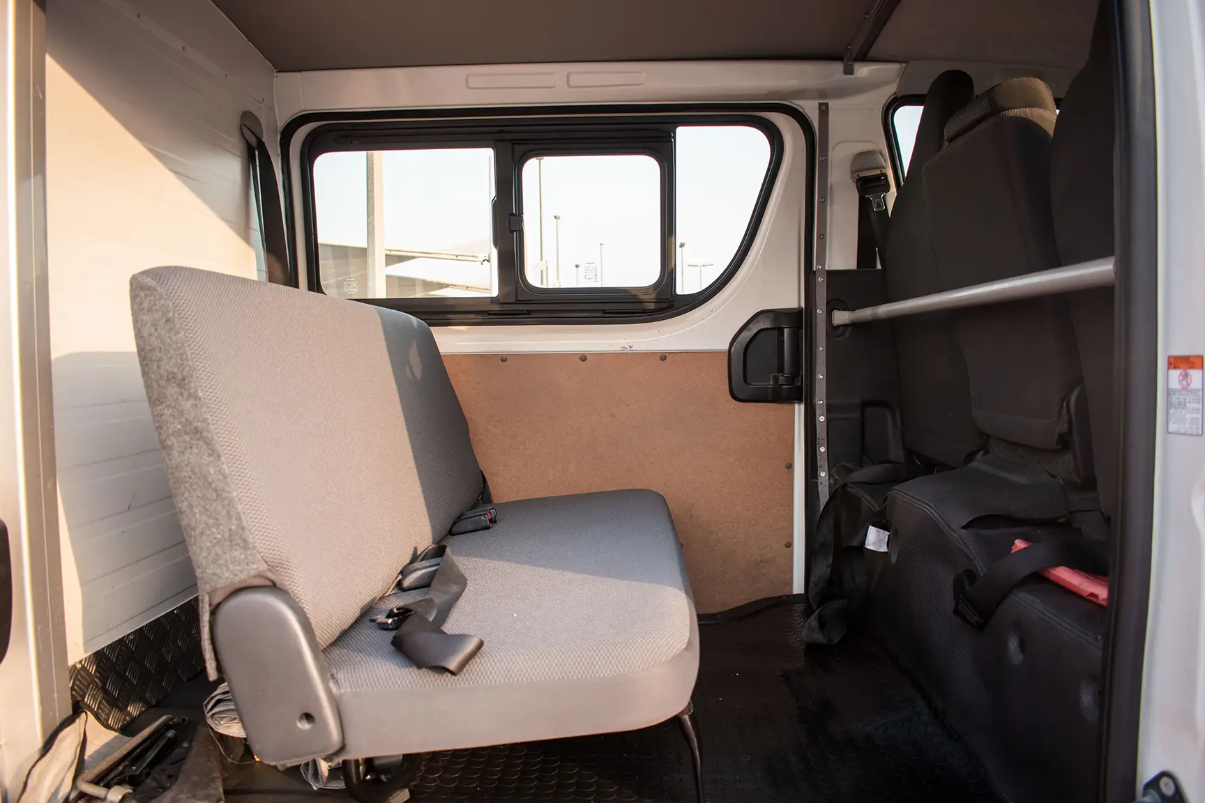 Used 2017 Toyota Hiace GL -Std Roof 6 STR Panel Van White – Rear Passenger Side Cabin View at First Choice Cars Sharjah