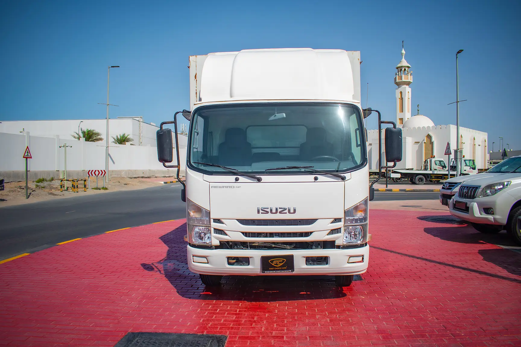 Used 2019 Isuzu NPR Cargo Box in White – Front View for Sale at First Choice Cars Dubai Sharjah