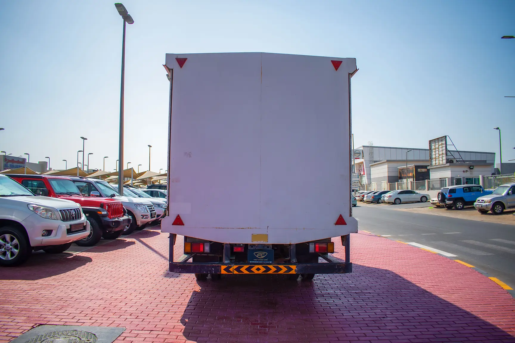 Used 2019 Isuzu NPR Cargo Box in White – Back/Rear View for Sale at First Choice Cars Dubai Sharjah